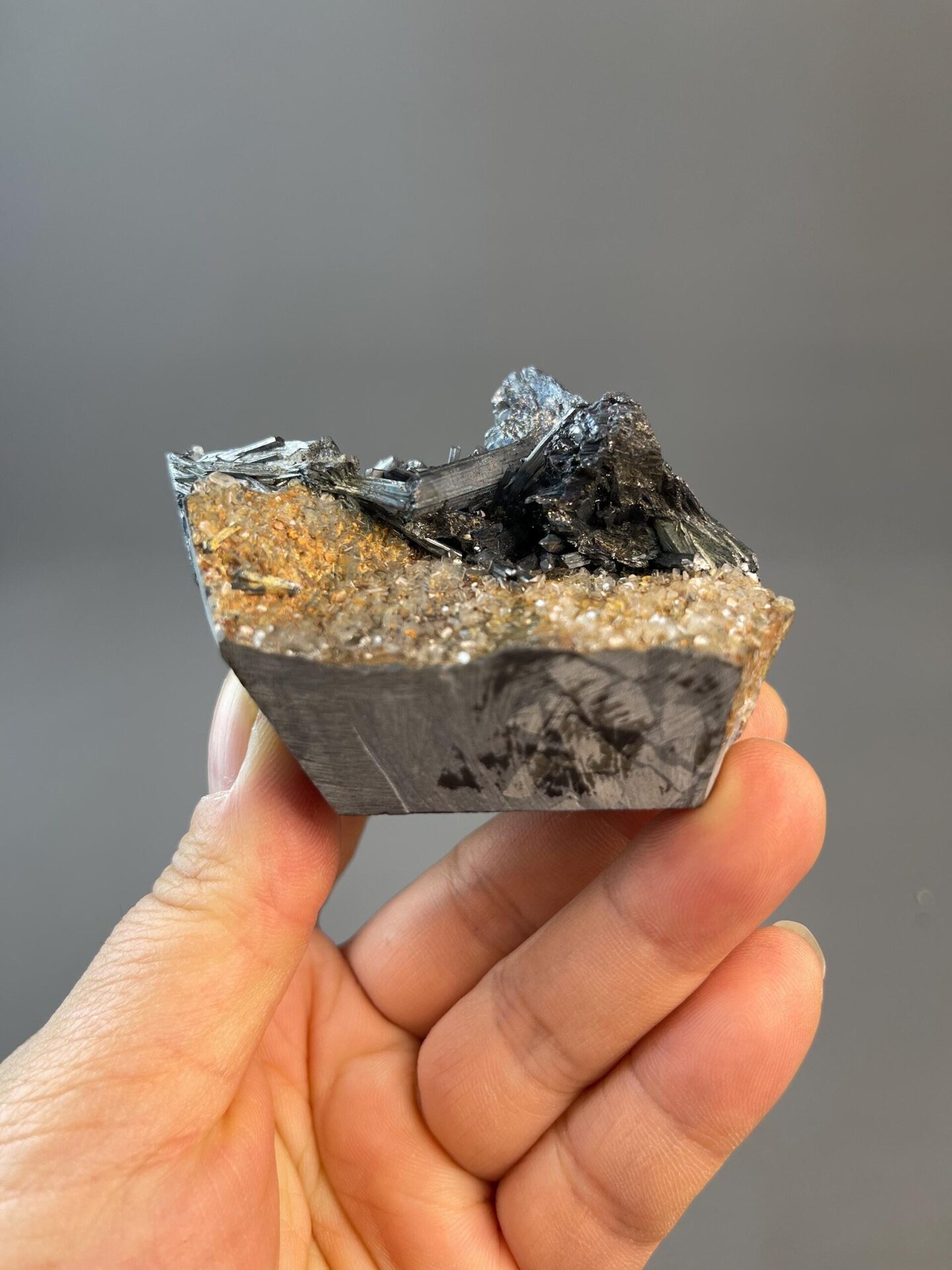 Close-up of stibnite metallic blades on natural matrix