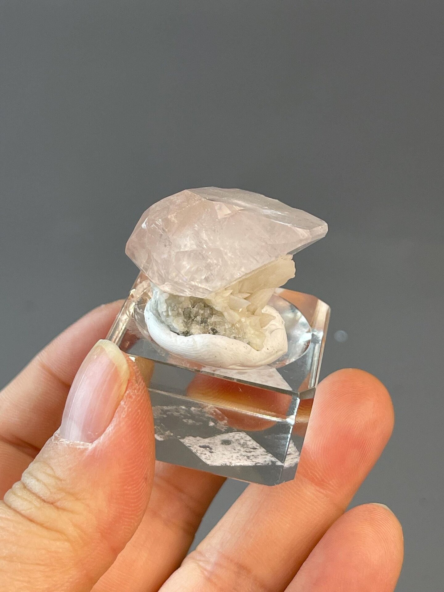 Pink calcite crystal showing vivid color and transparency