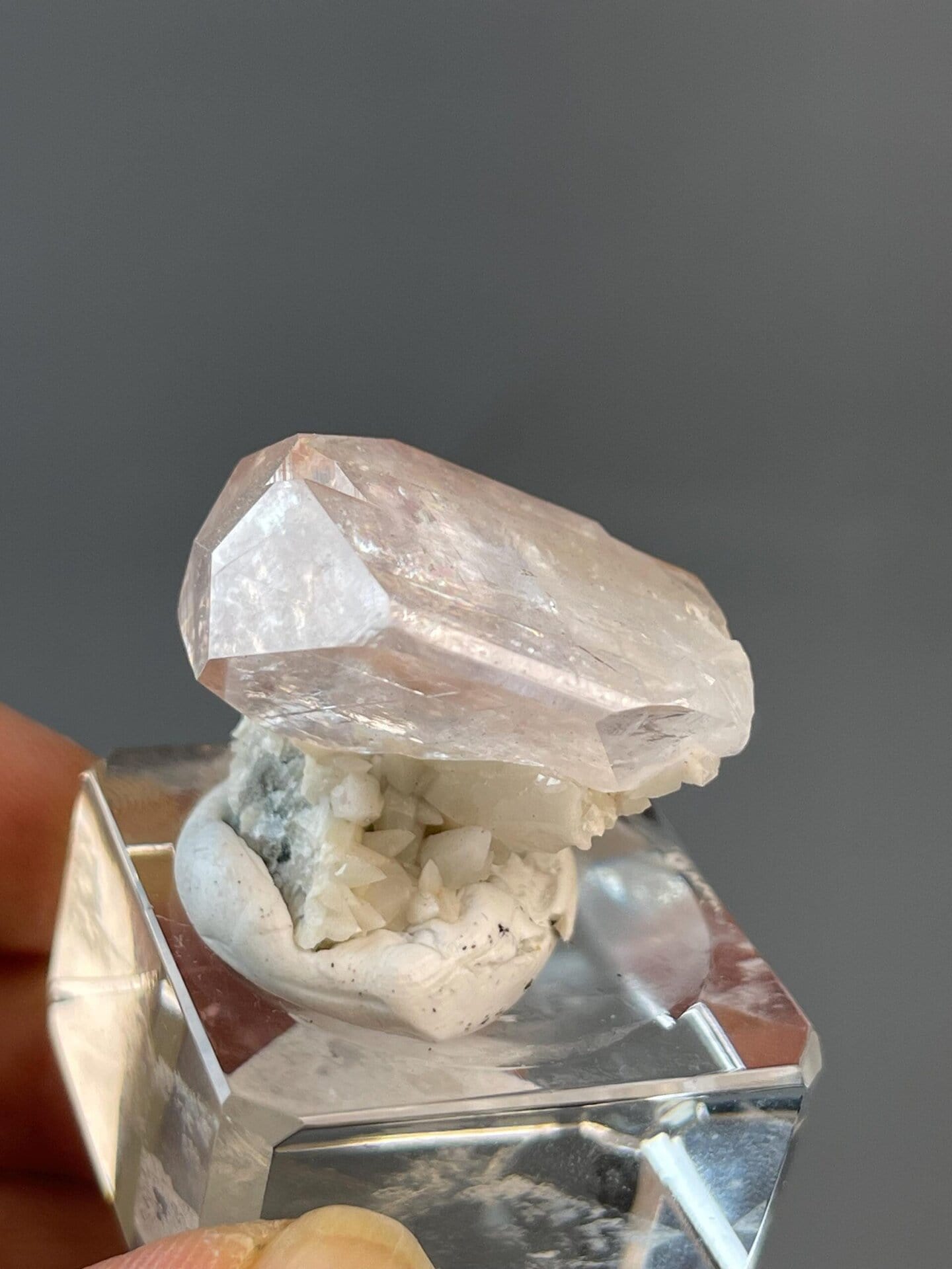 Pink calcite crystal displaying vitreous luster