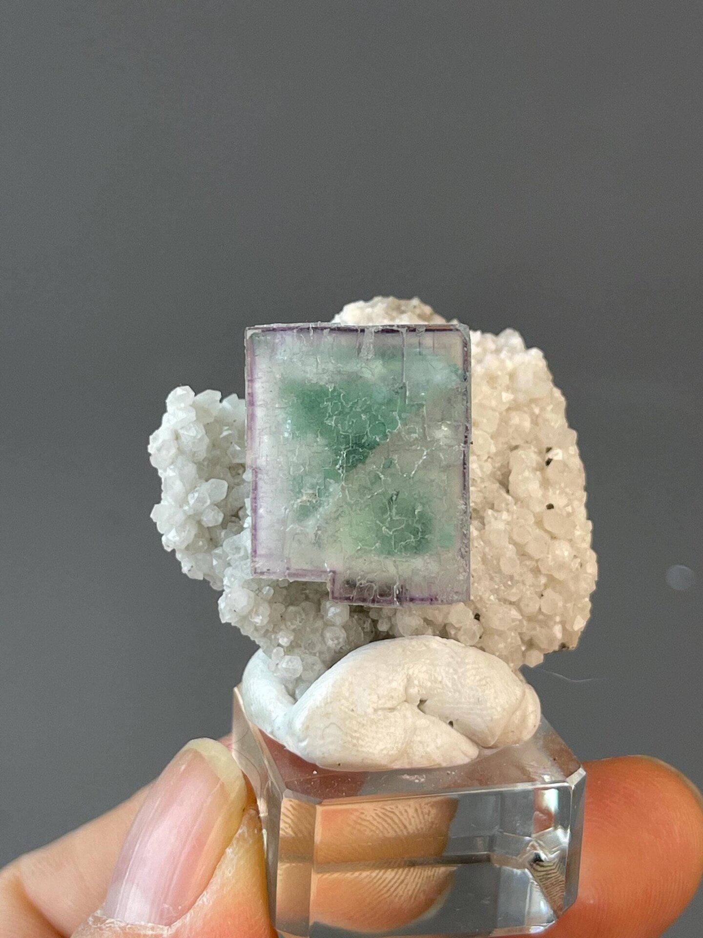 Rich violet cubic fluorite crystal on natural matrix