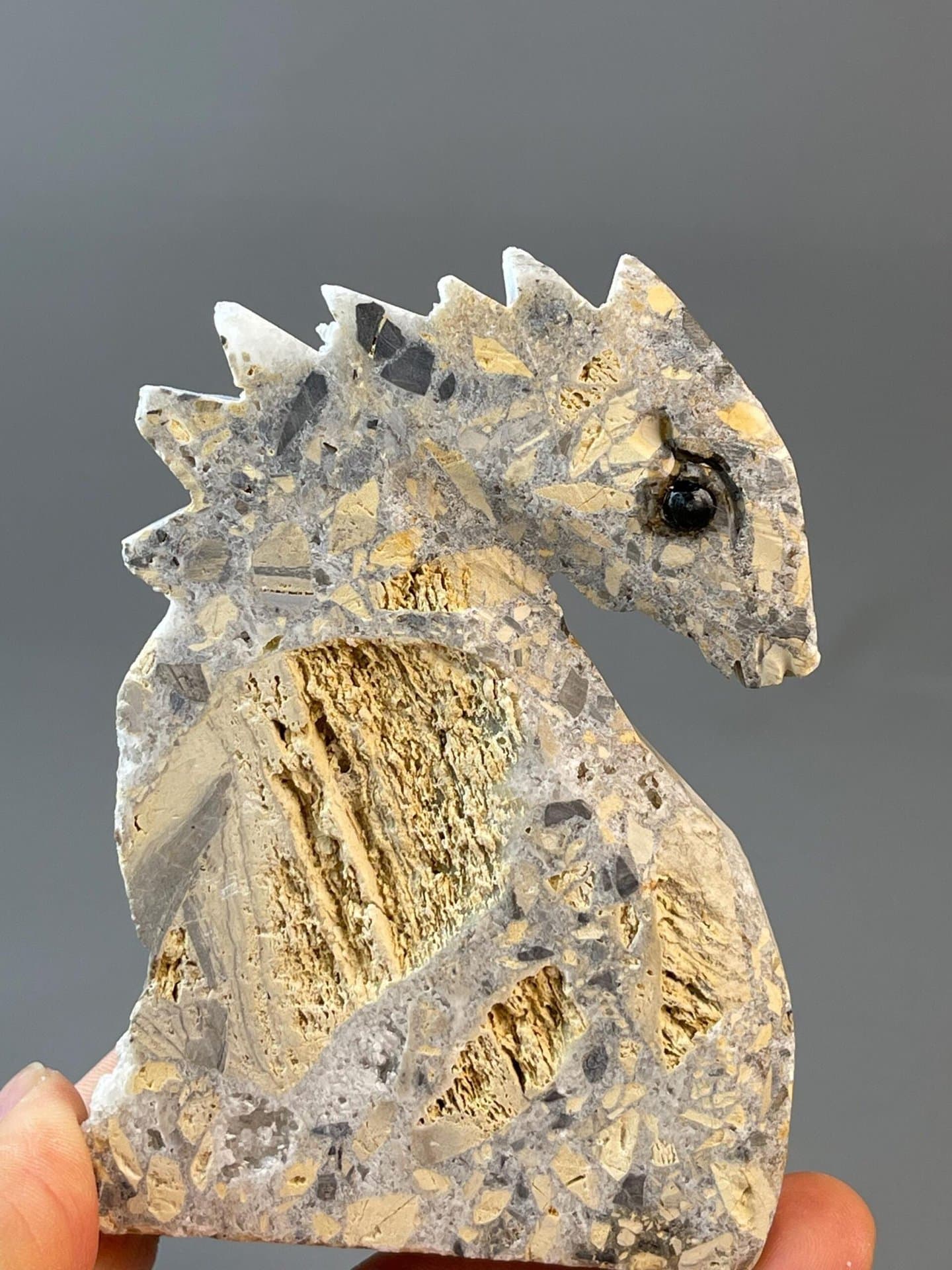 White quartz seahorse carving with black onyx eye detail