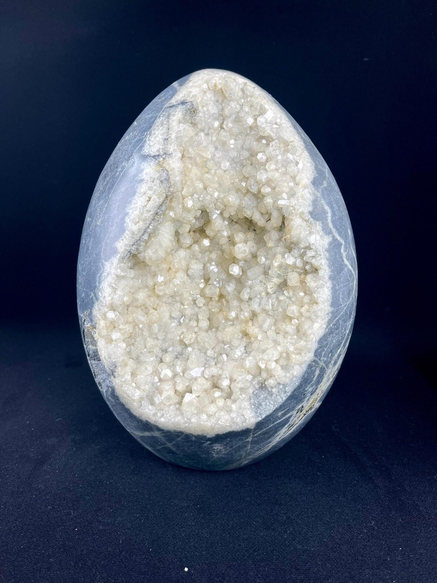 Polished exterior and sparkling crystal interior, calcite egg