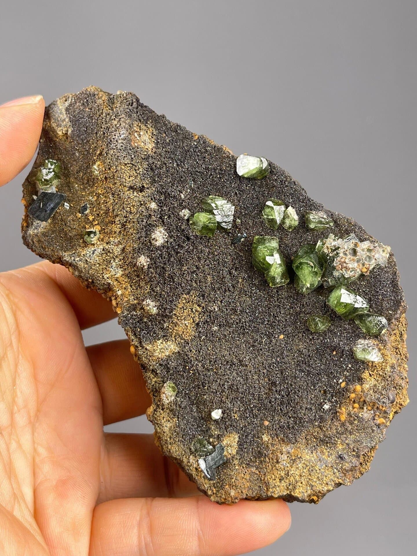 Andradite Ca3Fe2Si3O12 isometric green crystals on matrix
