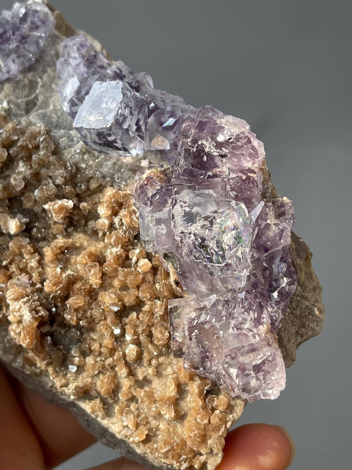 Twinned phantom fluorite crystals on lustrous mica base