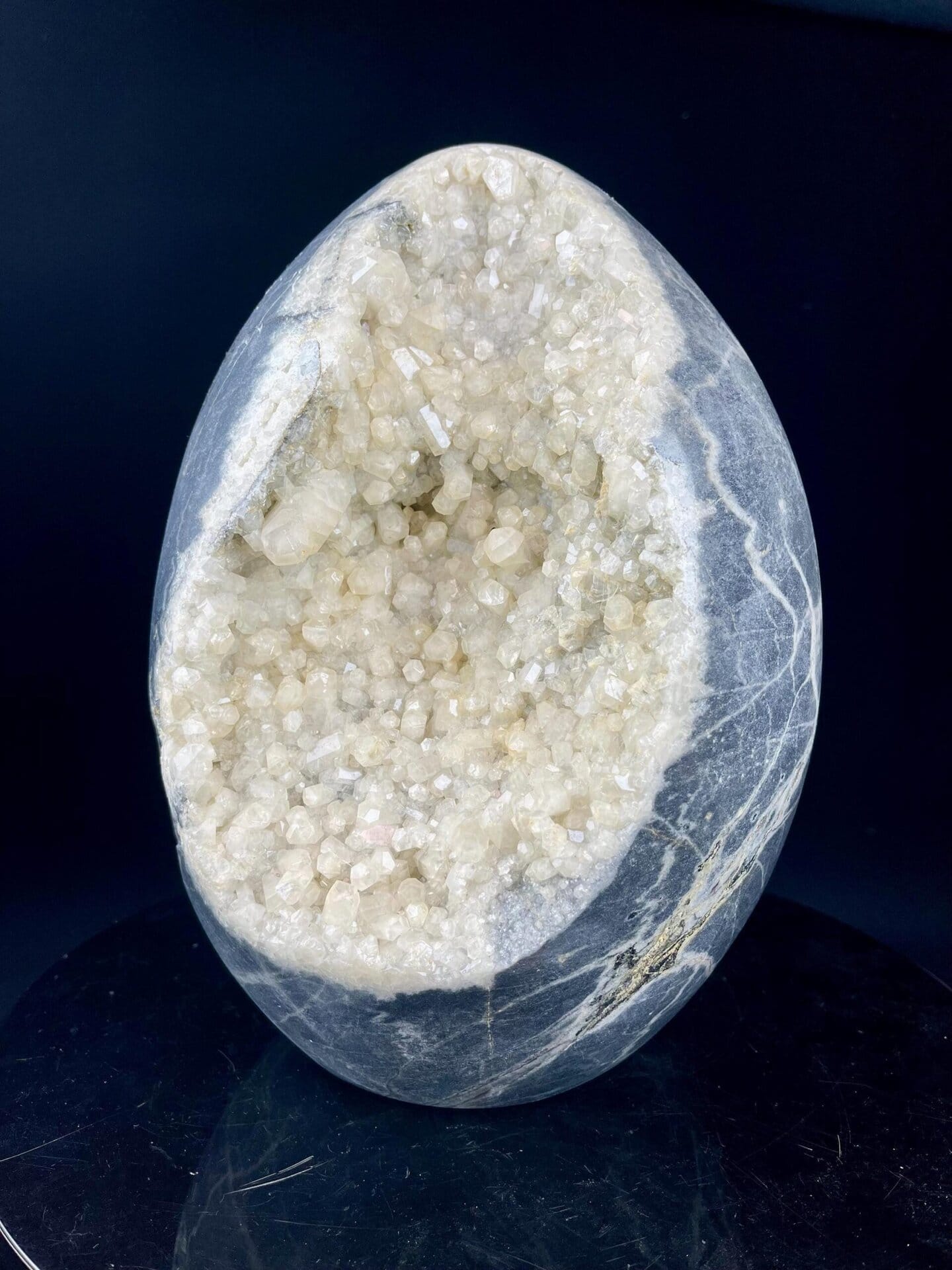 Scale view of 9.0x5.0x7.0 in large calcite geode egg
