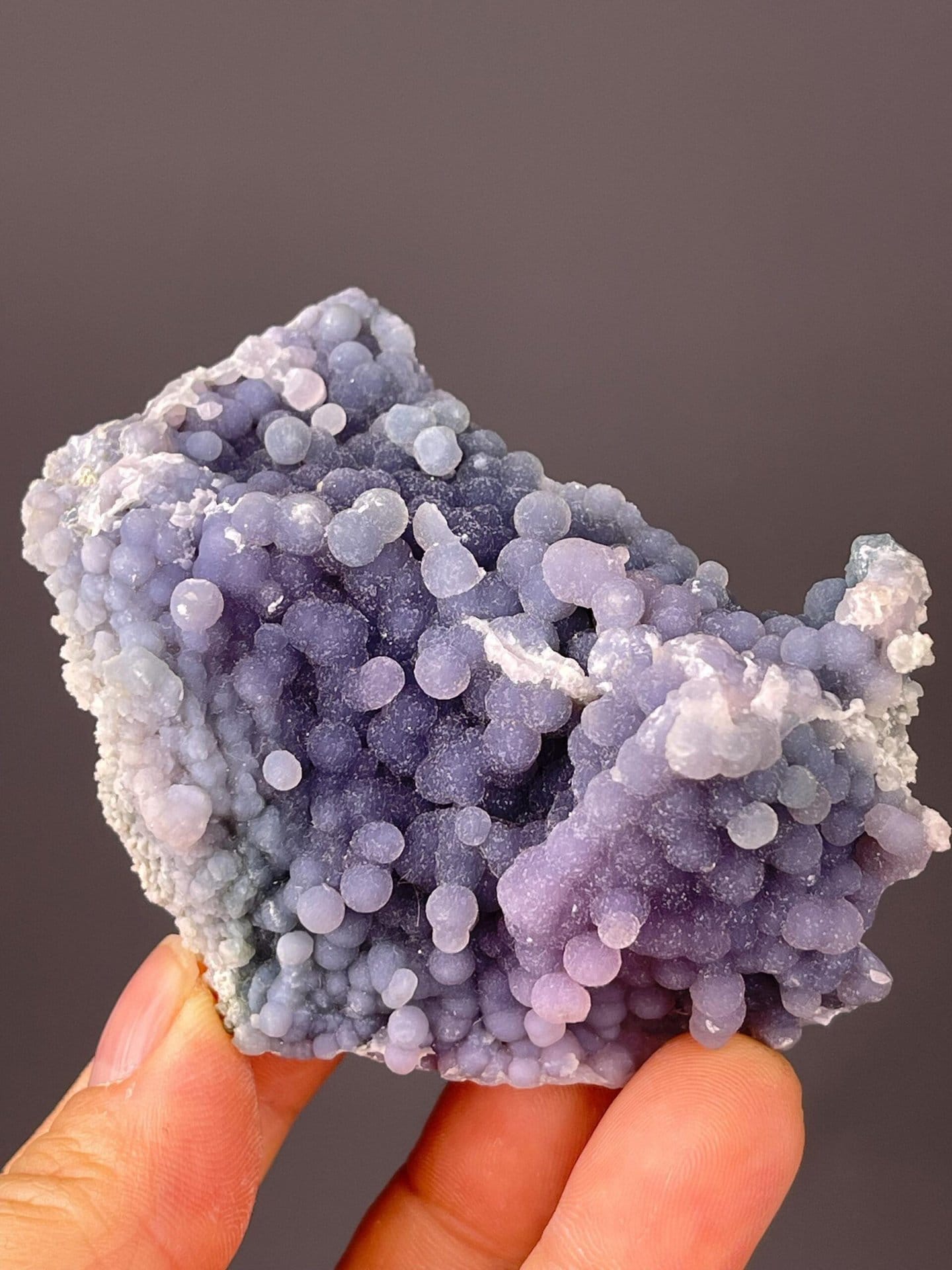 Scale view of 2.8x1.2x2.6 in lavender grape agate