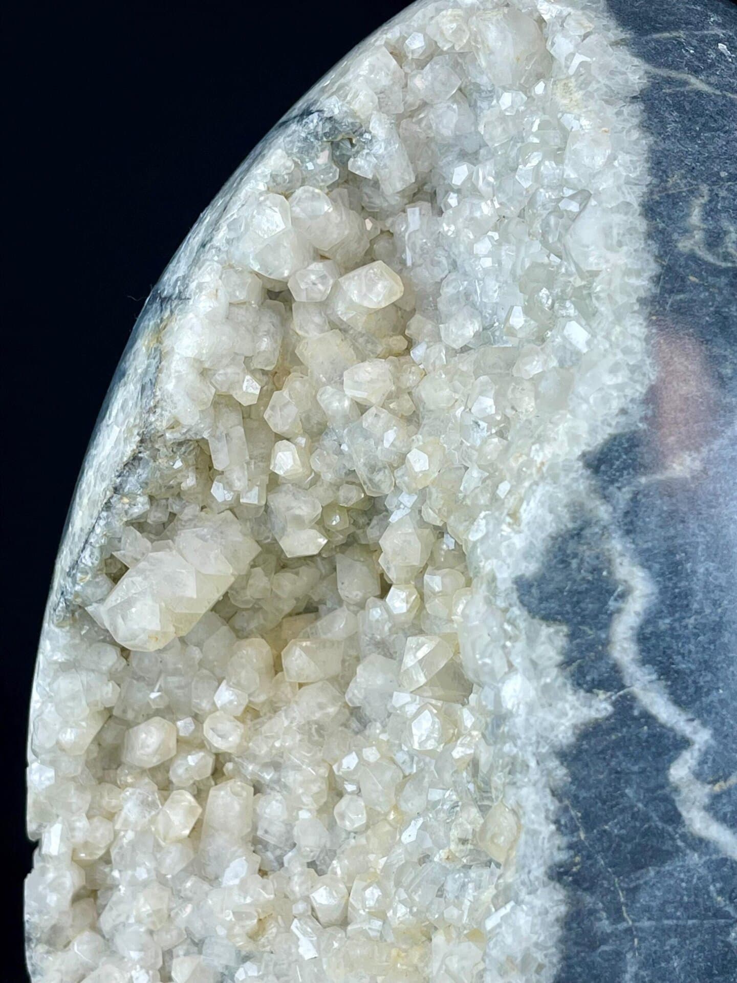 Calcite geode egg displaying vitreous crystal luster interior