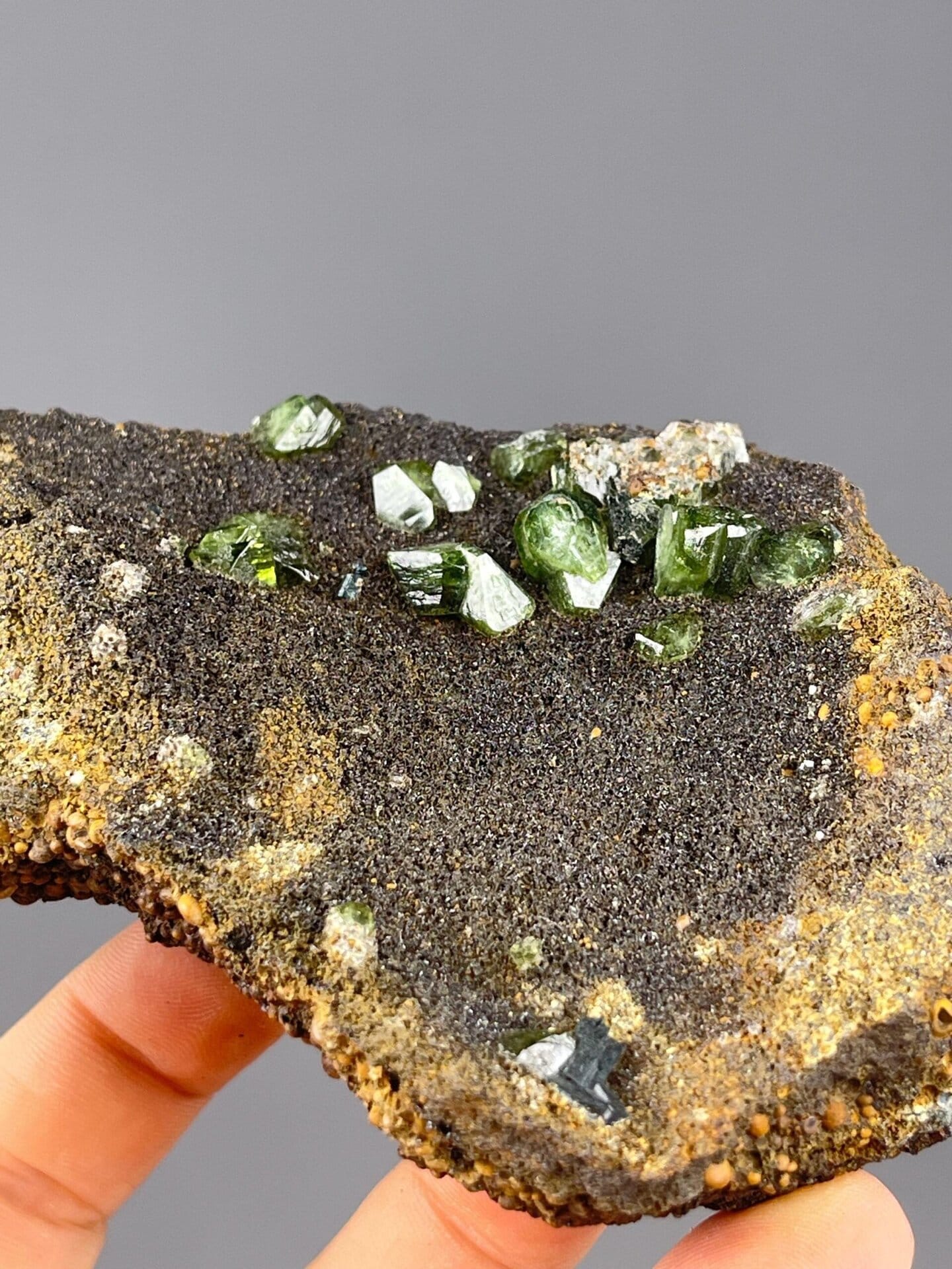 Green andradite garnet cluster displaying adamantine luster