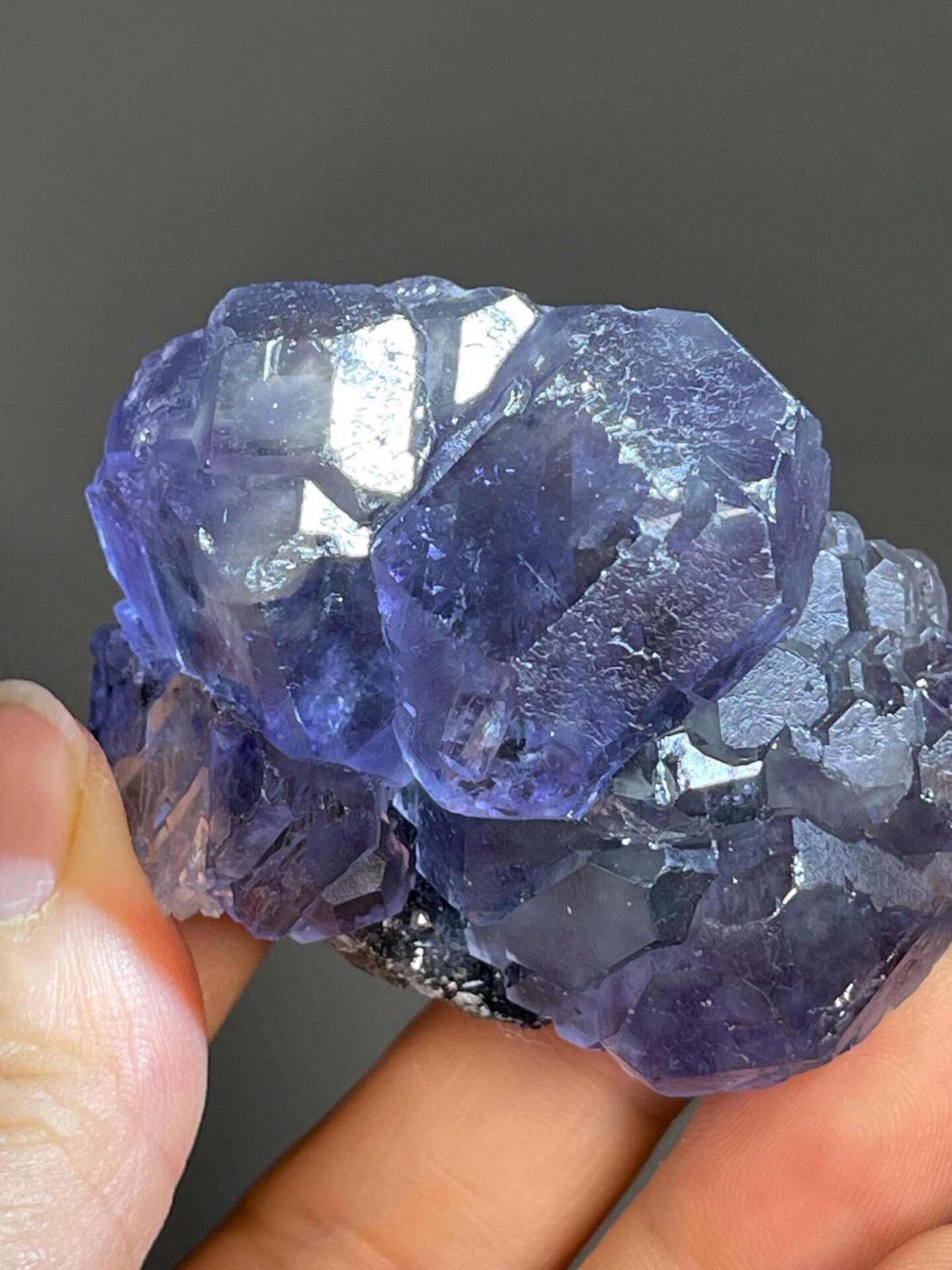 Purple-green phantom fluorite cluster displaying vitreous luster