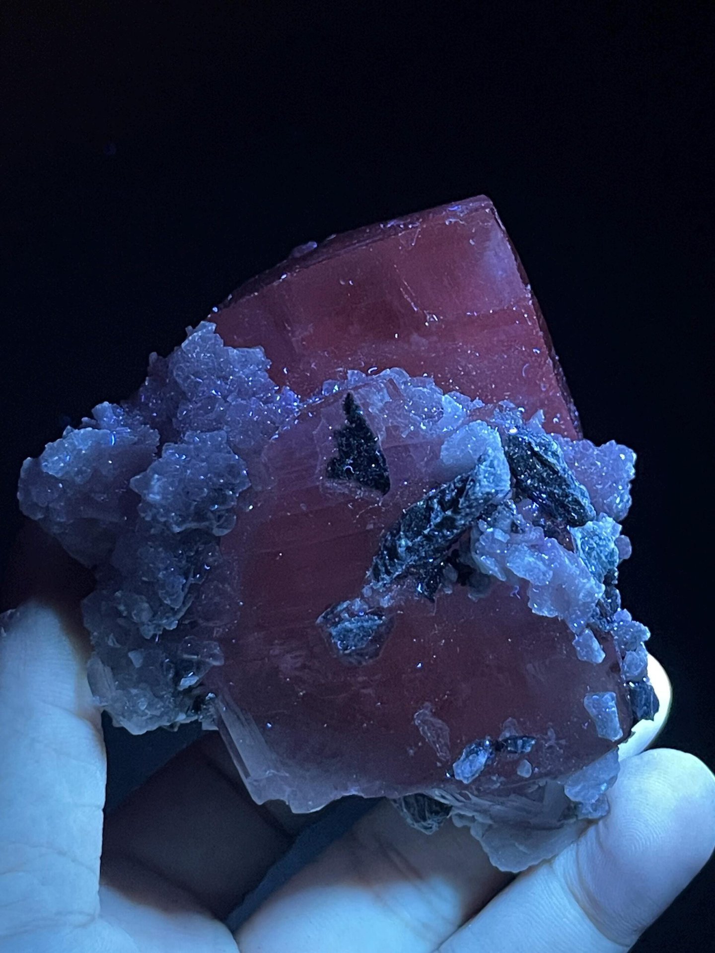 Calcite tower crystal displaying vitreous luster on matrix