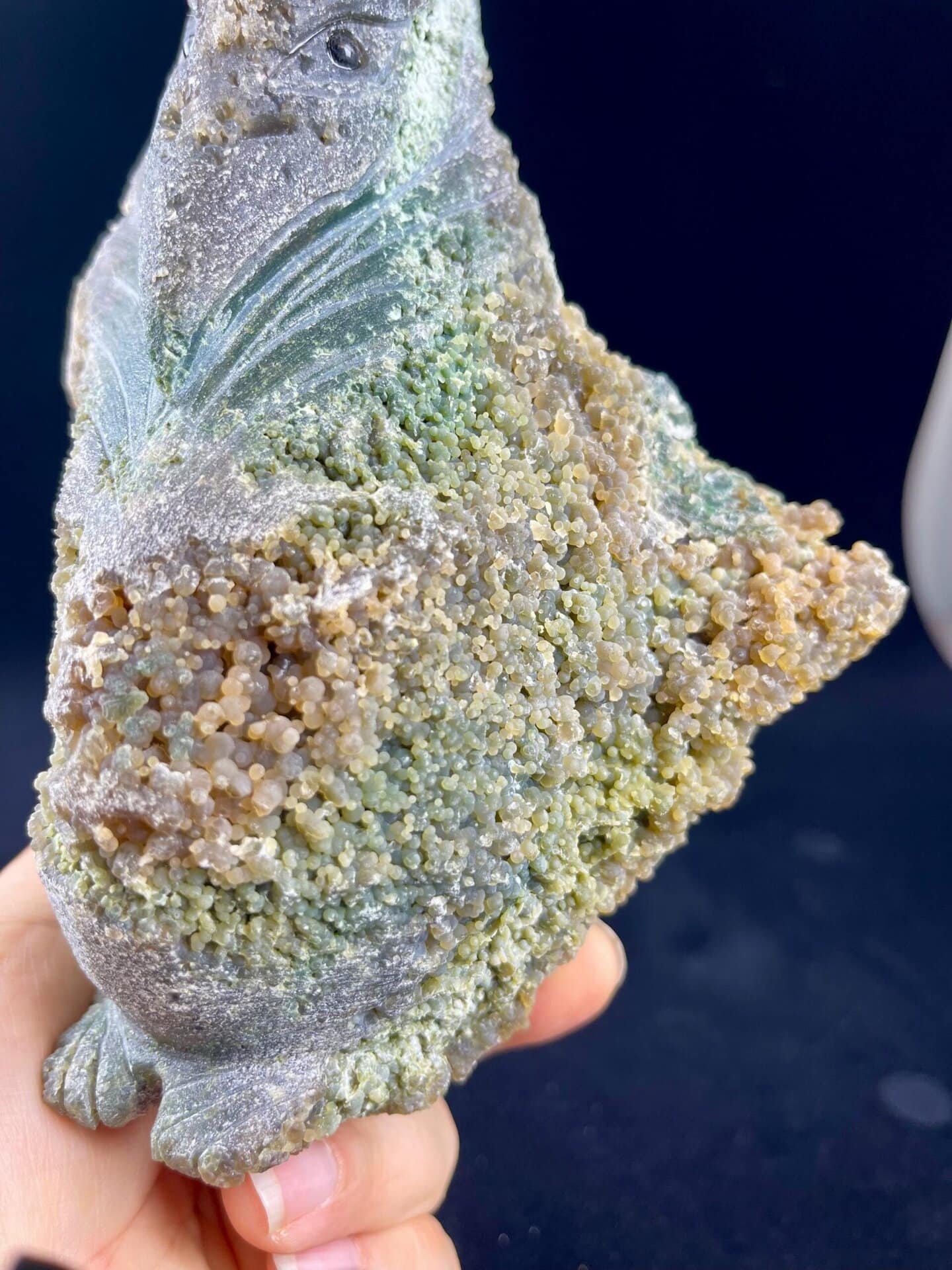 Top view of hand-carved grape agate pterosaur sculpture