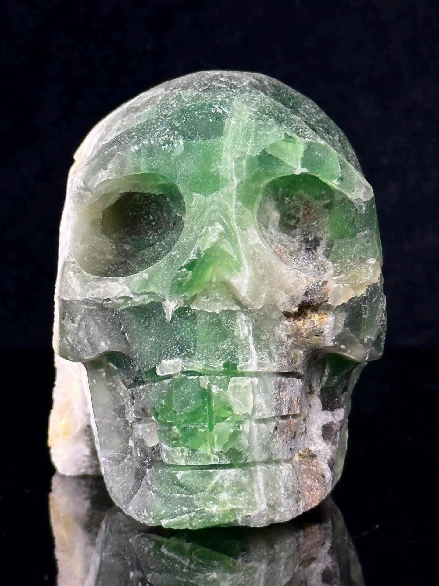 CaF₂ isometric fluorite carved into skull form with hollow geode