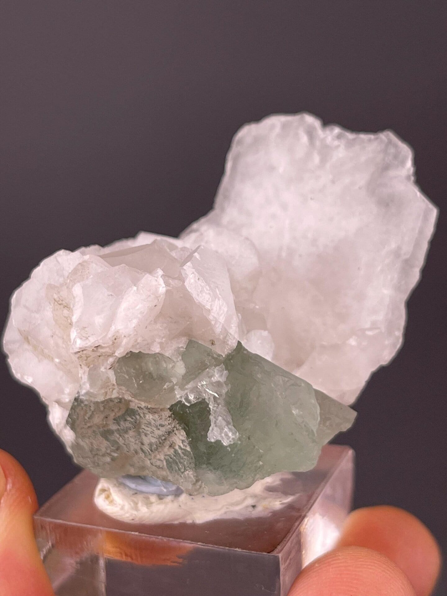Translucent green CaF₂ fluorite with calcite matrix