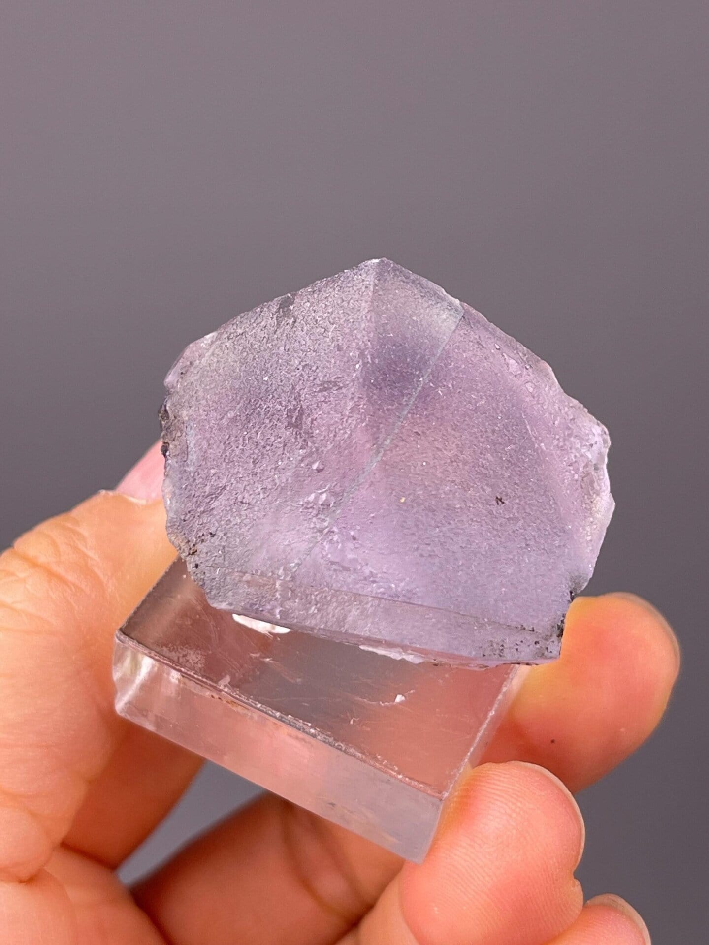 Fluorite crystal with natural dissolution etch pits on faces