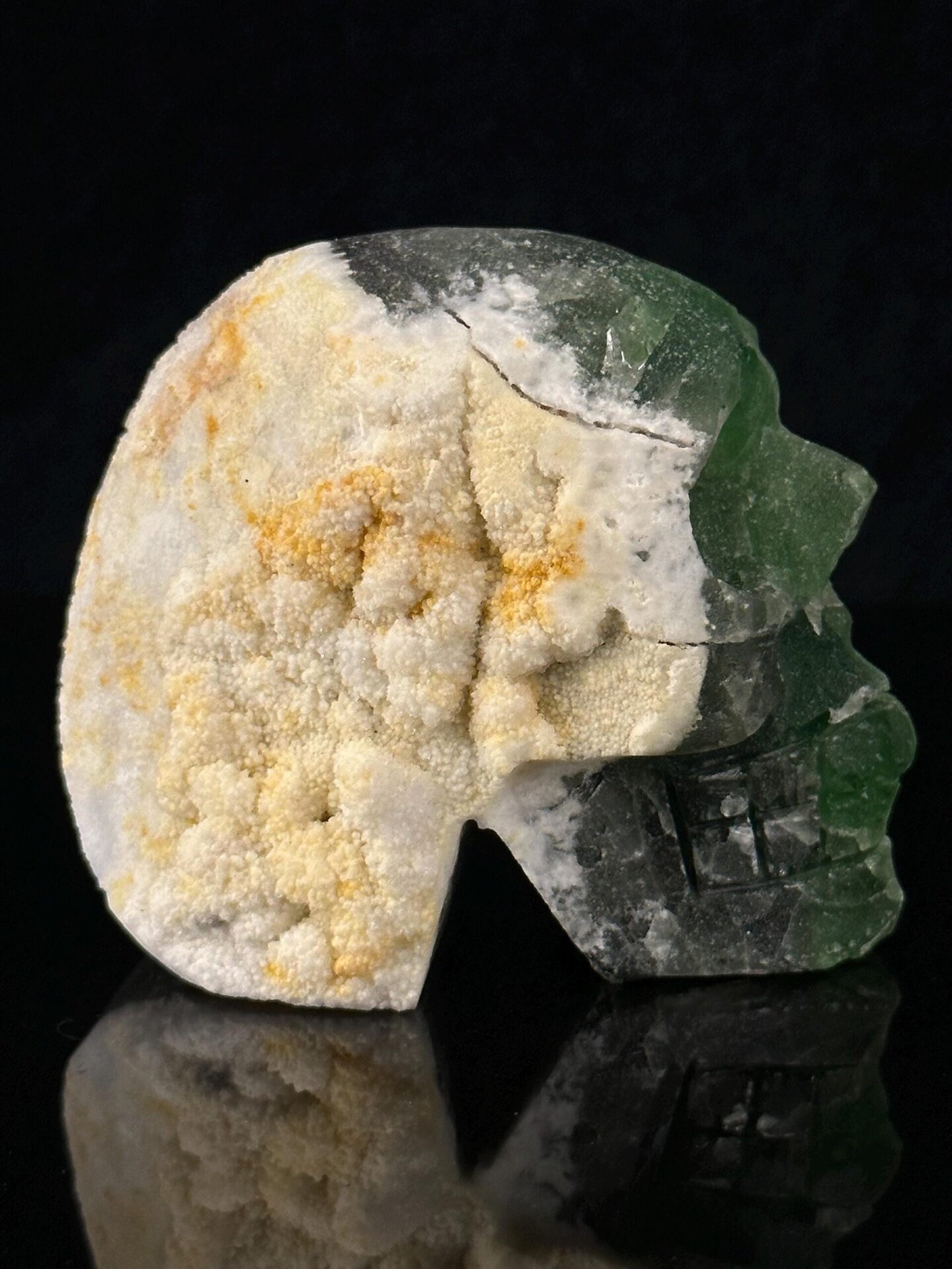 Mineral art: green fluorite skull with geode hollow interior