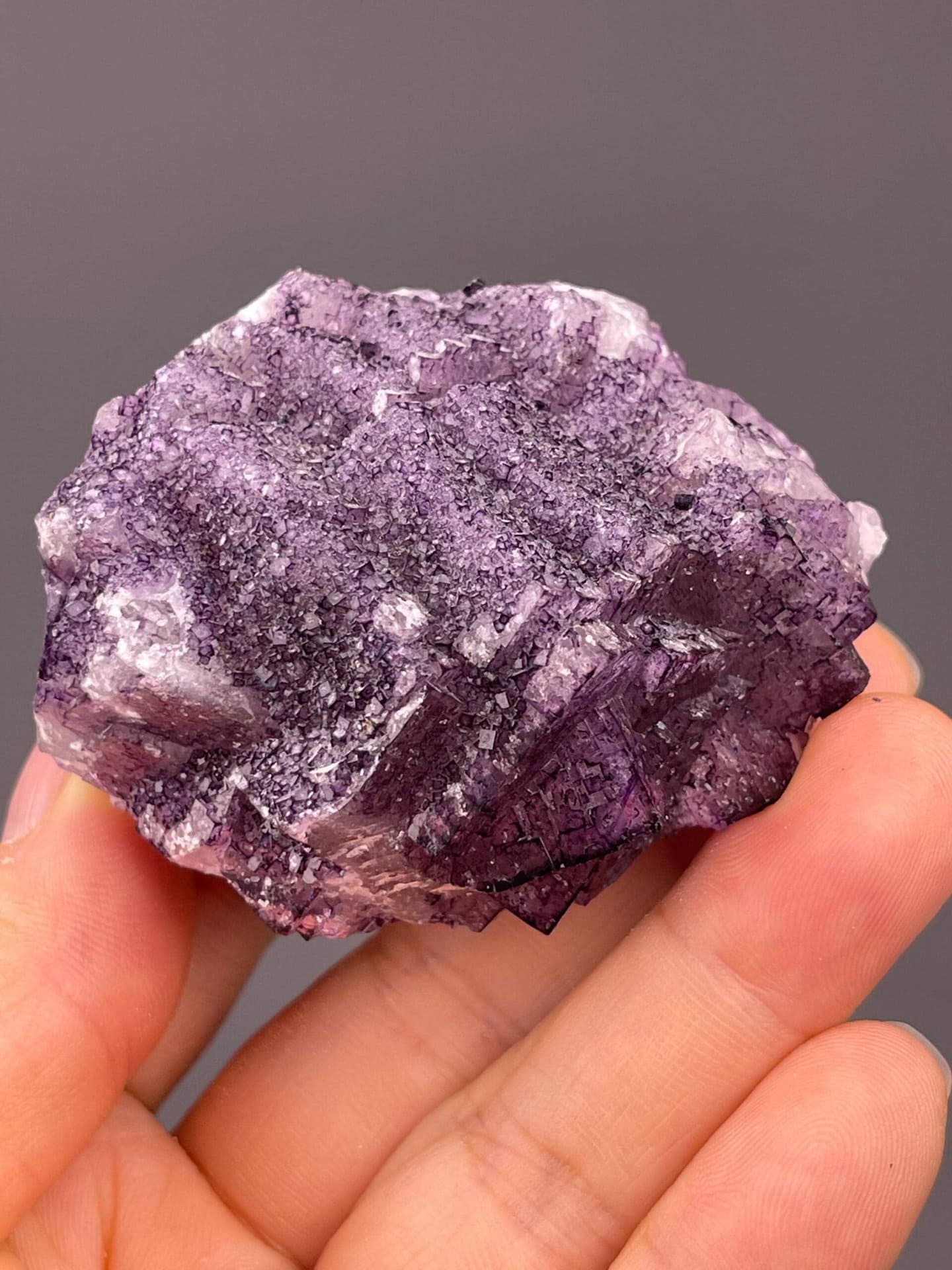 Purple fluorite cluster with textured 3D surface from Guizhou, China
