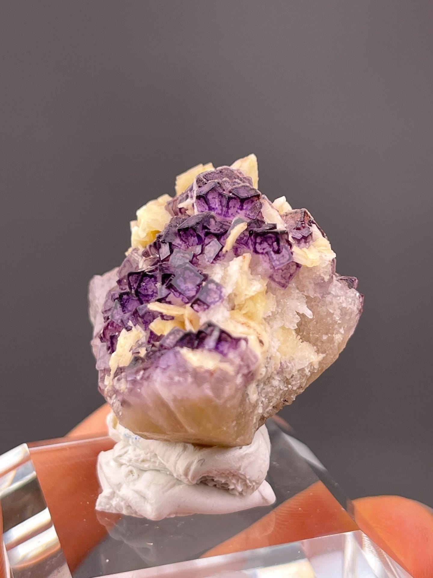 Deep purple cubic fluorite cluster with stacked crystals
