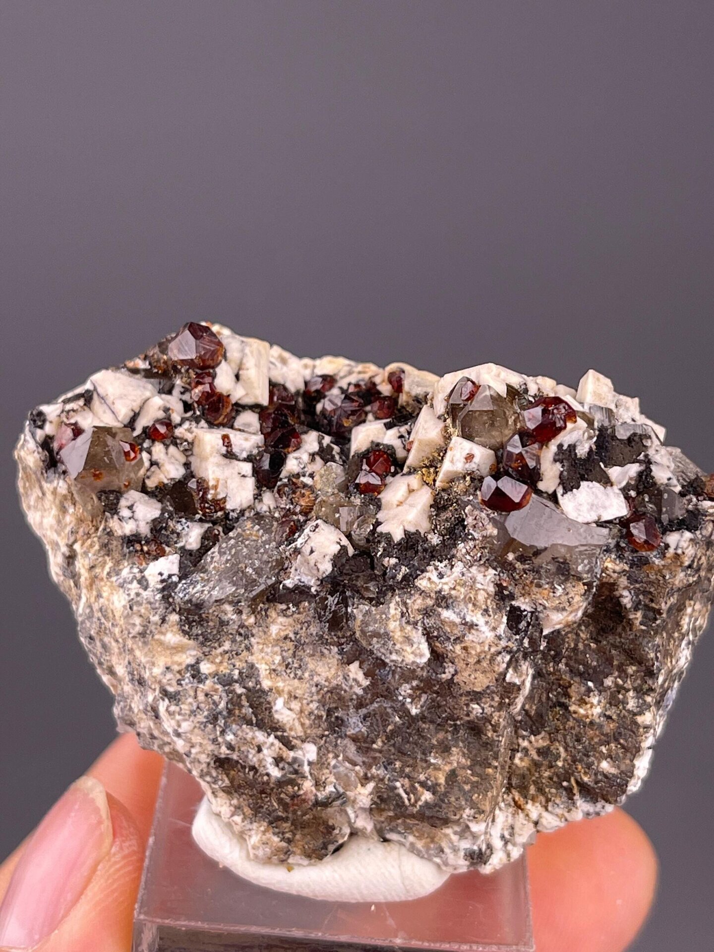 Red garnet dodecahedral crystals with feldspar matrix from Fujian