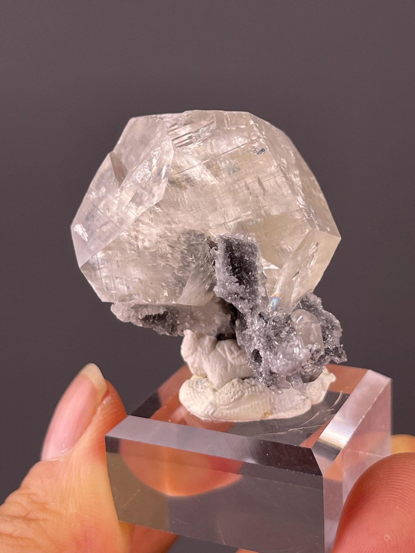 Clear calcite with perfect rhombohedral geometry and flat faces