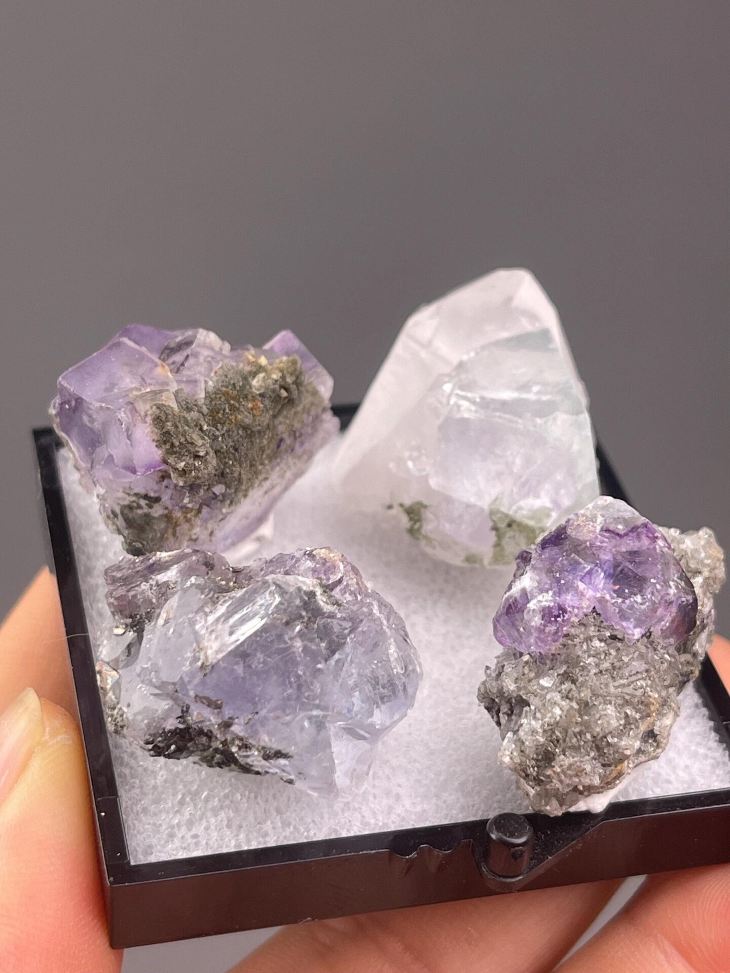 Close-up of matching purple fluorite cubic crystals set
