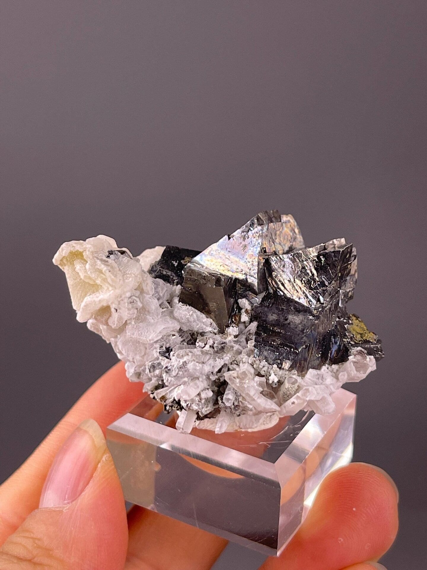 Arsenopyrite crystal faces on quartz matrix