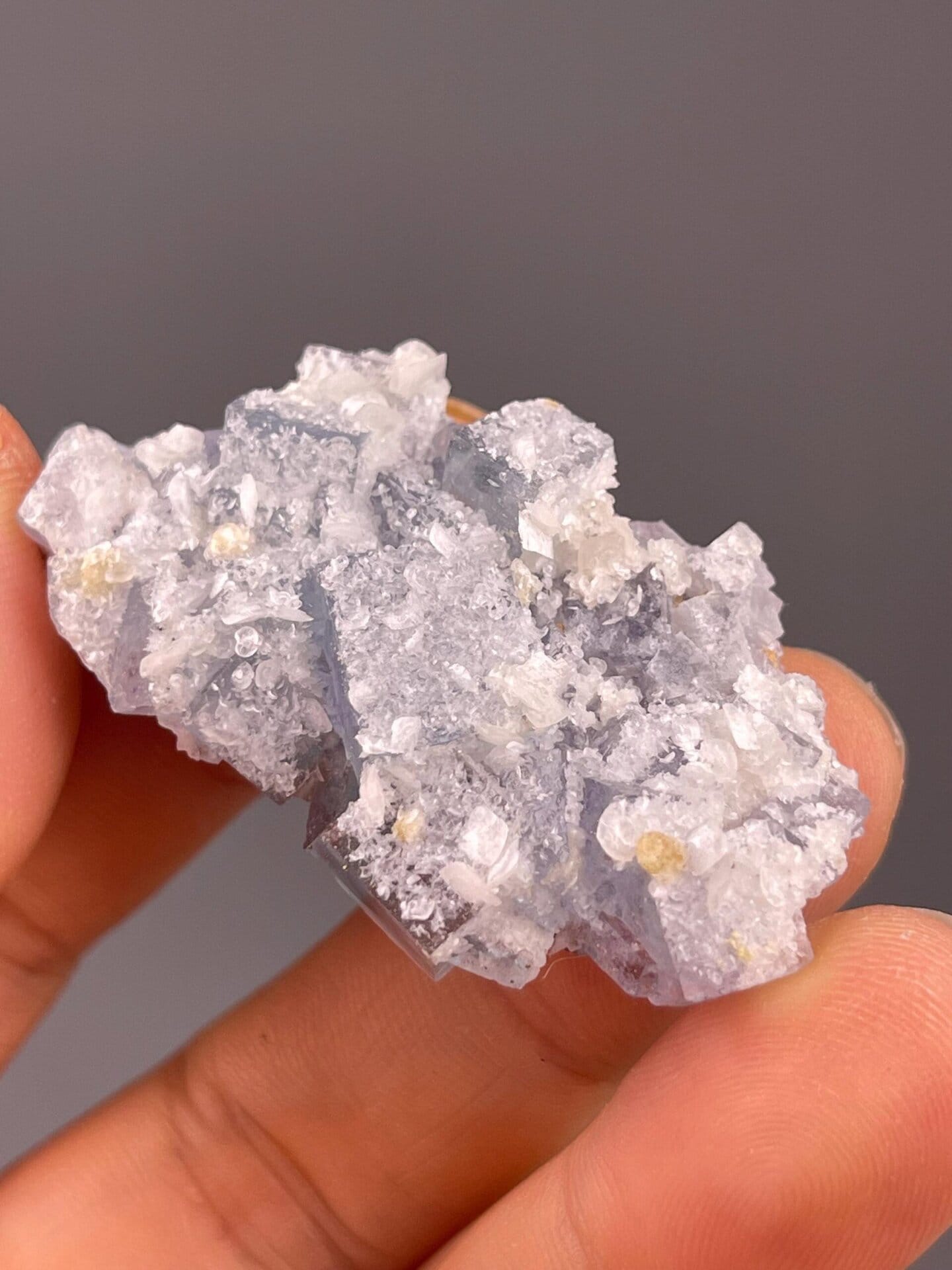 Blue fluorite cube faces on calcite close-up