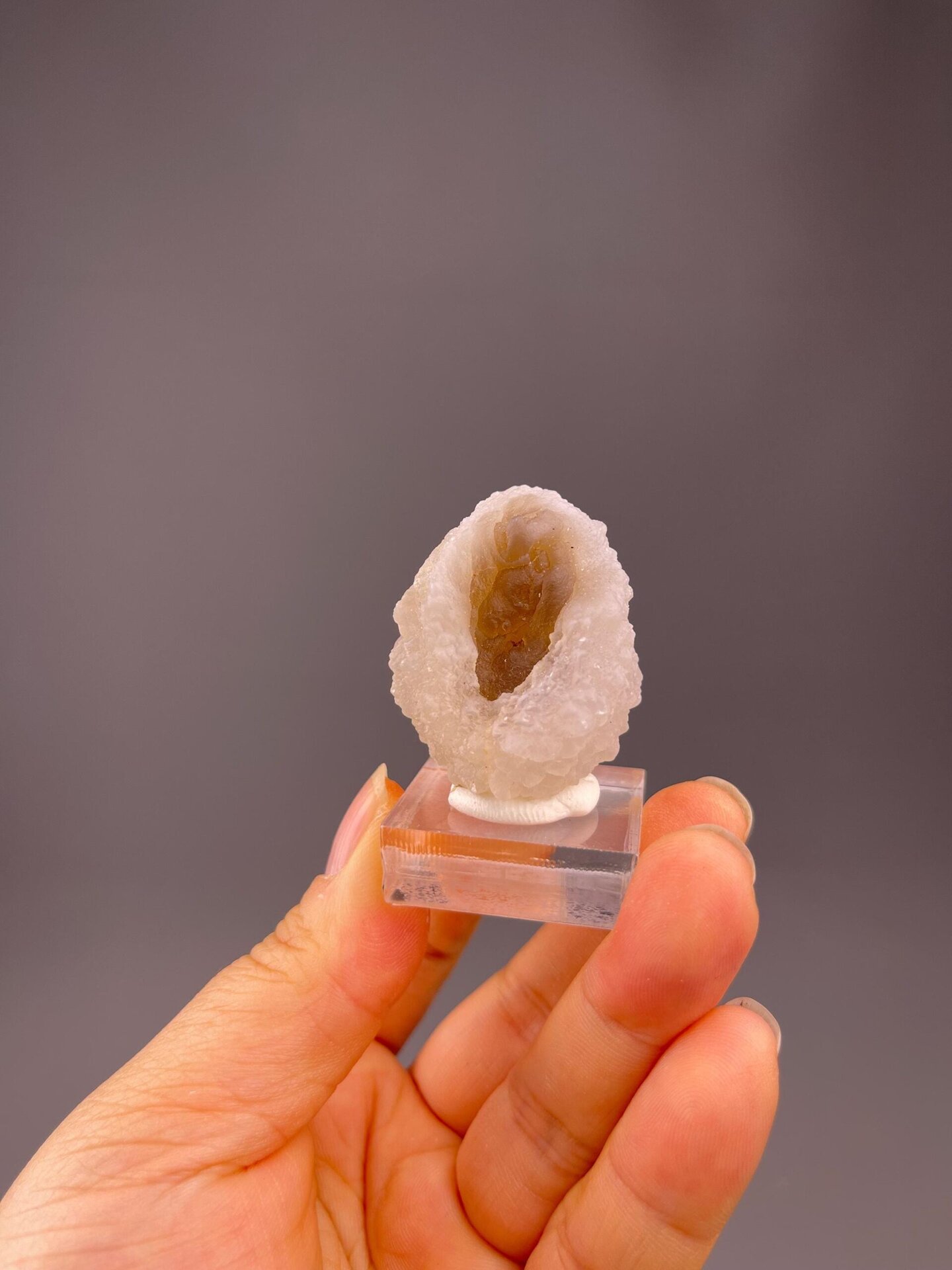 Banded agate shell with druzy quartz interior