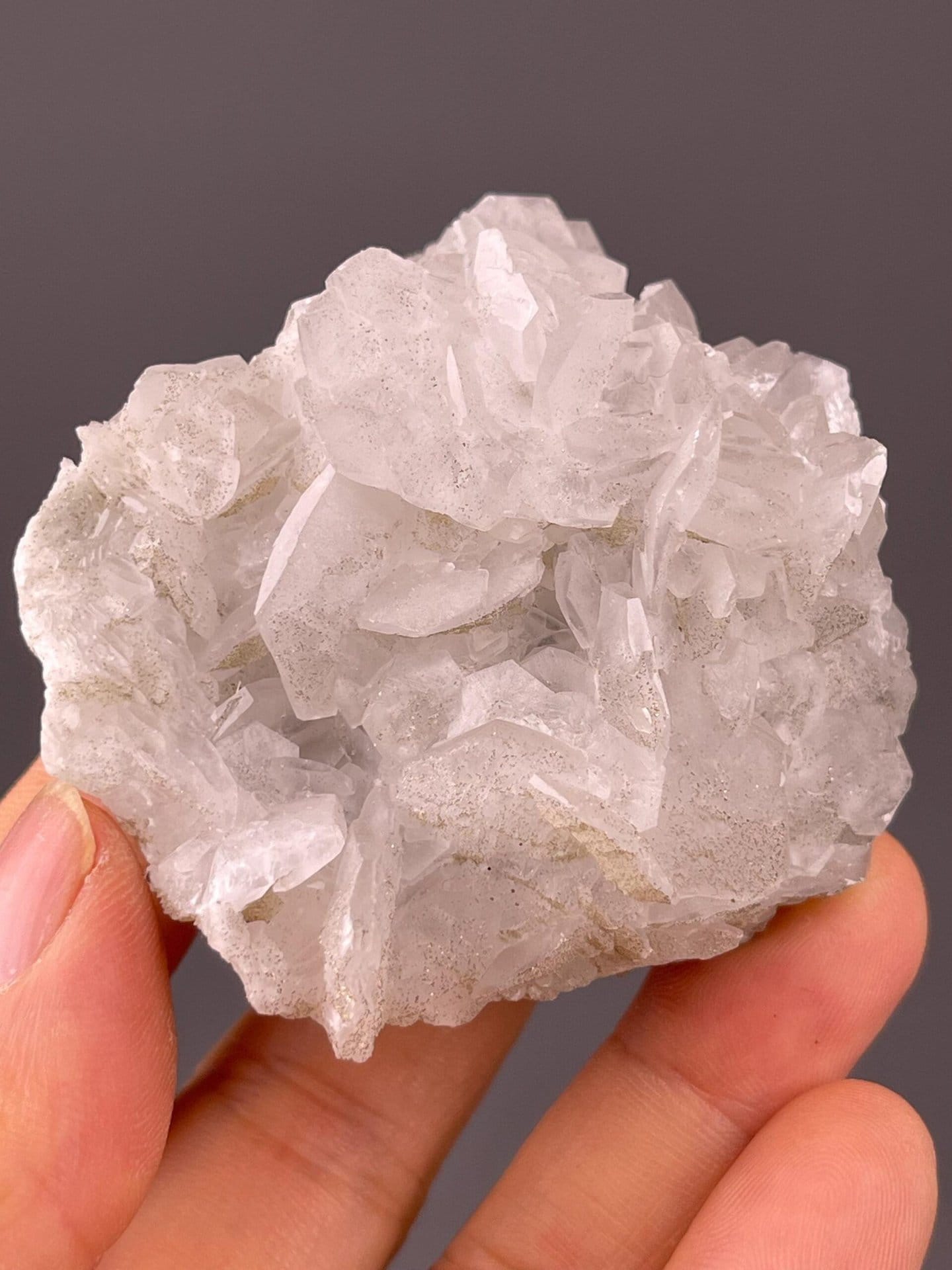 White calcite stalactitic habit showing petal structure