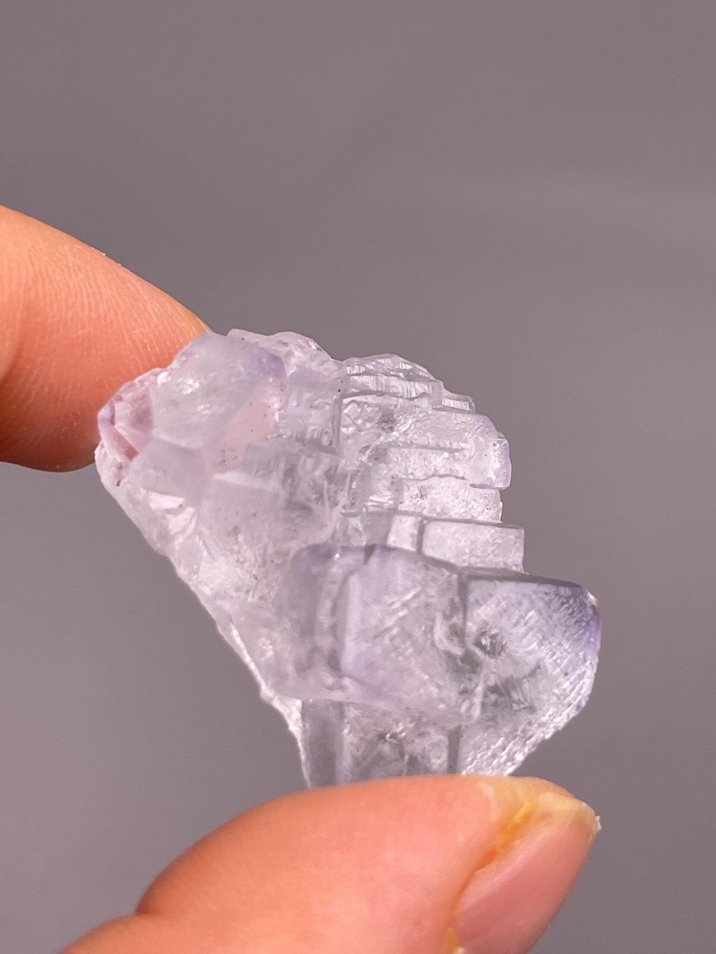 Surface detail of etched transparent fluorite crystal