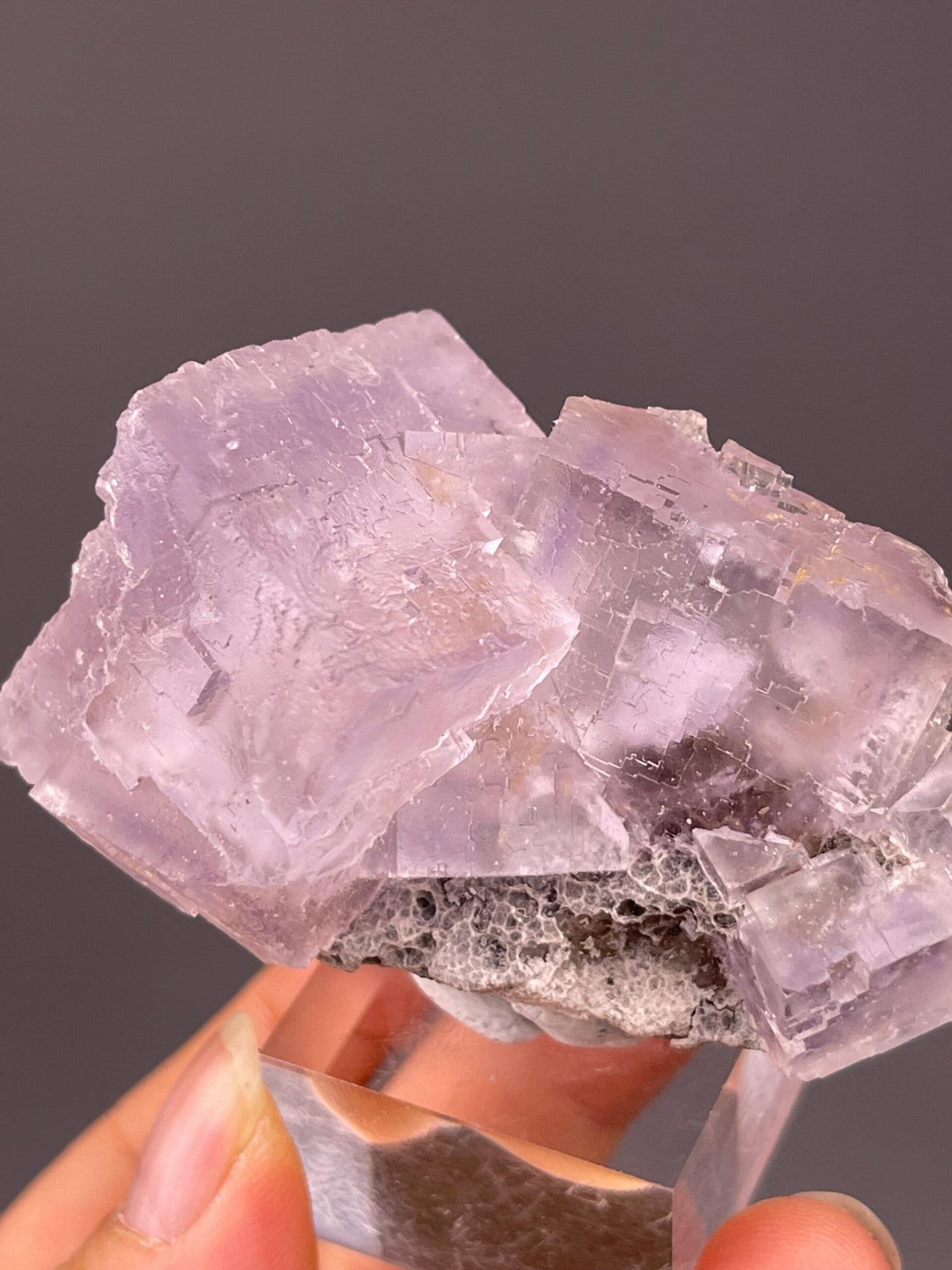 Full purple fluorite cluster on white background