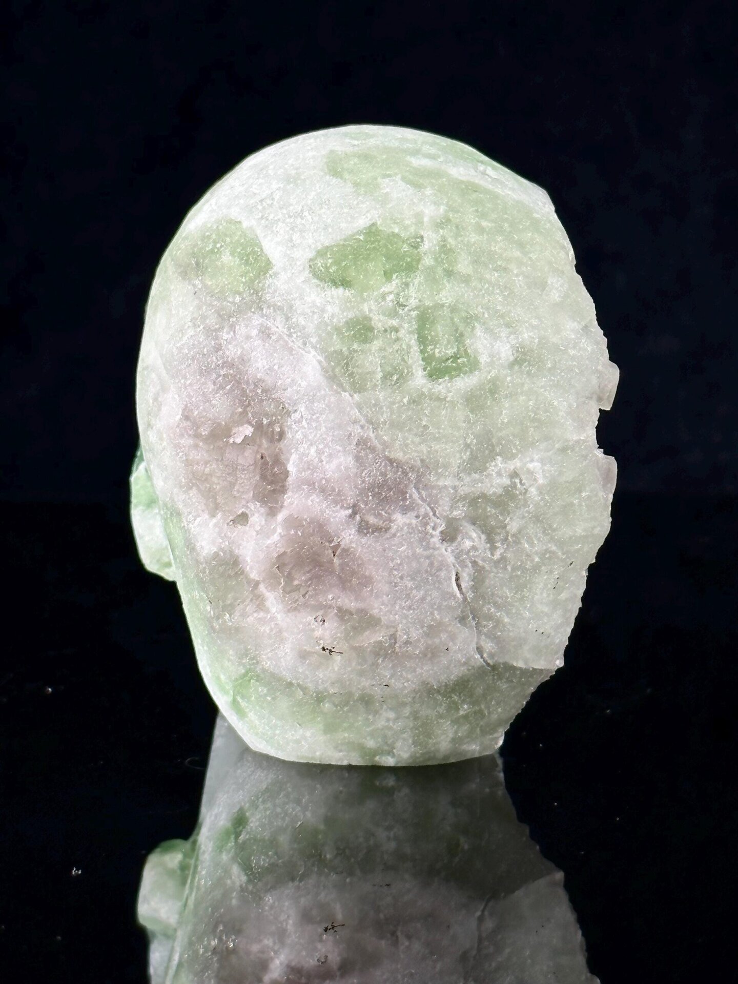 Green fluorite translucency lit skull