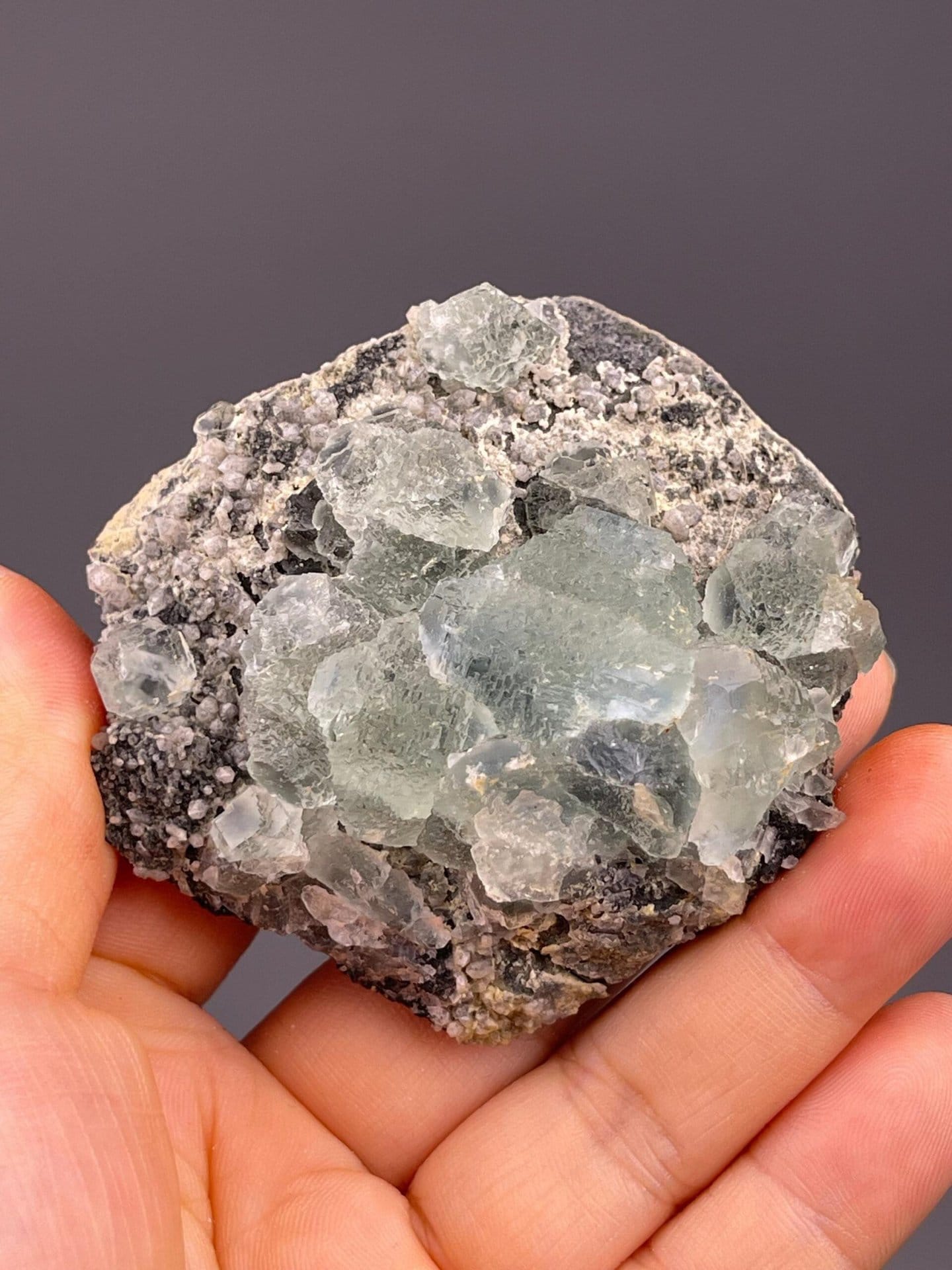 Full green fluorite specimen on white background