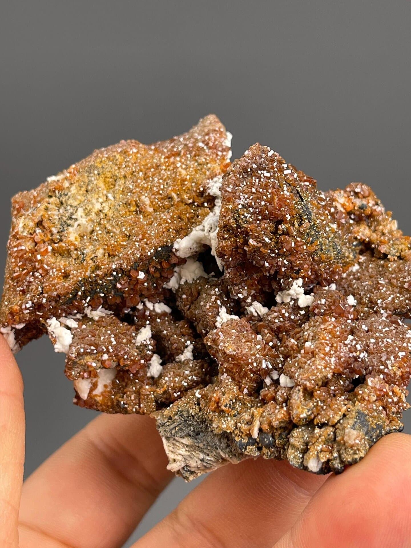 White barite matrix contrasting with red vanadinite