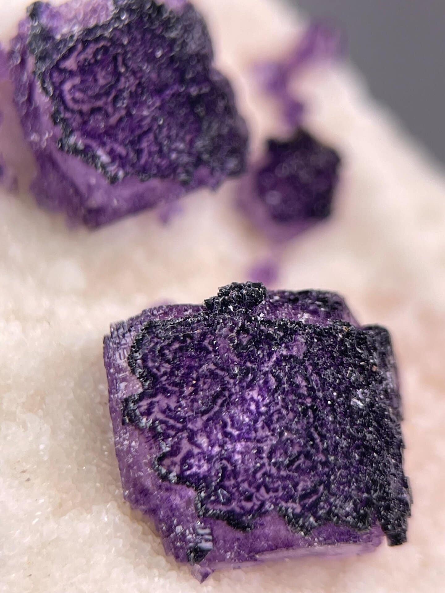 Top view of QR code pattern on purple fluorite crystal