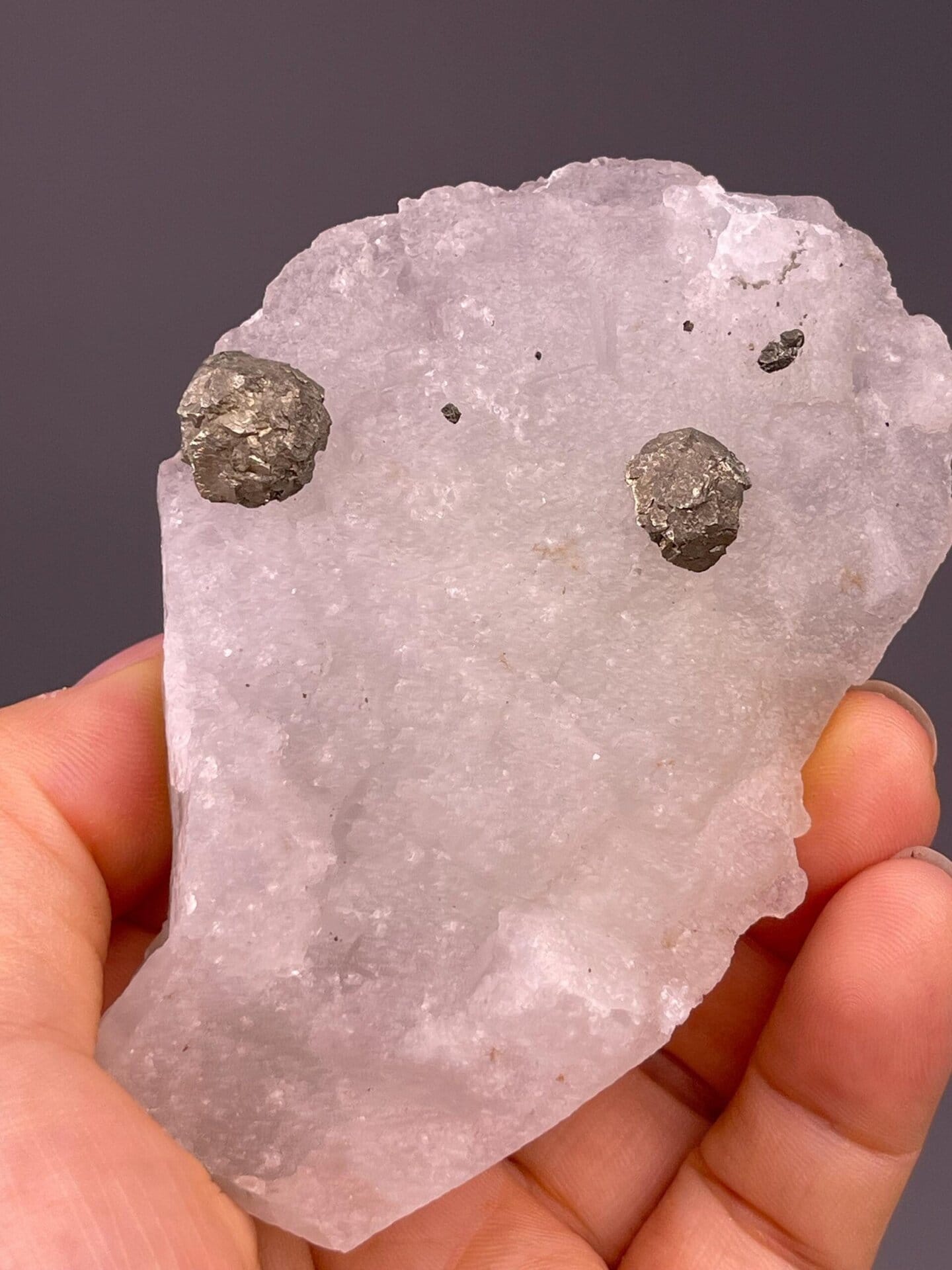 Top view of green fluorite with metallic nodules