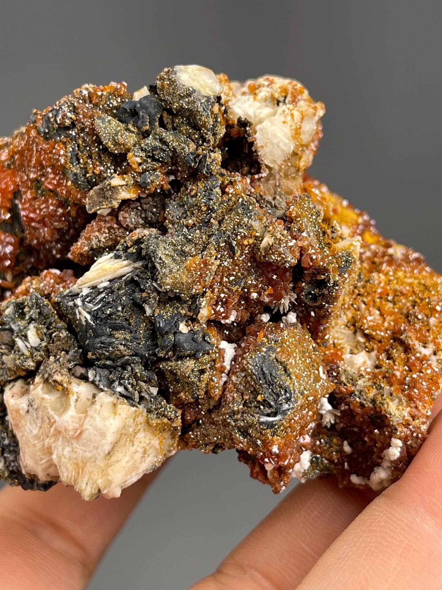 Vanadinite on barite matrix under studio lighting