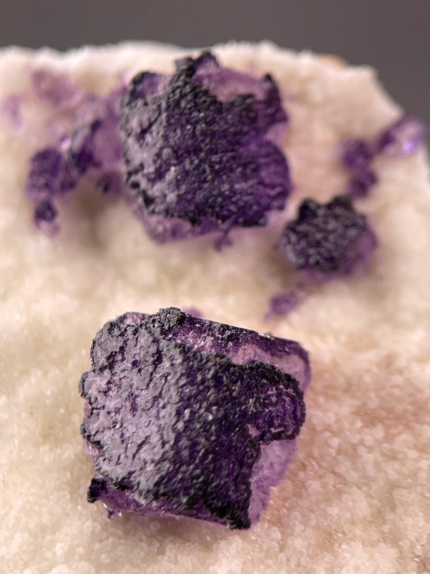 Geometric etched pattern detail on purple fluorite