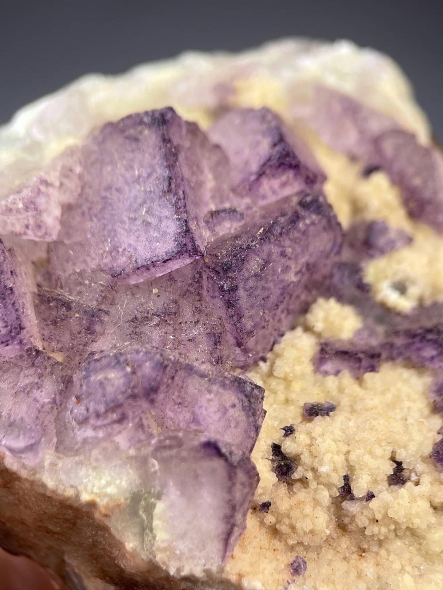 Full specimen purple fluorite on white background
