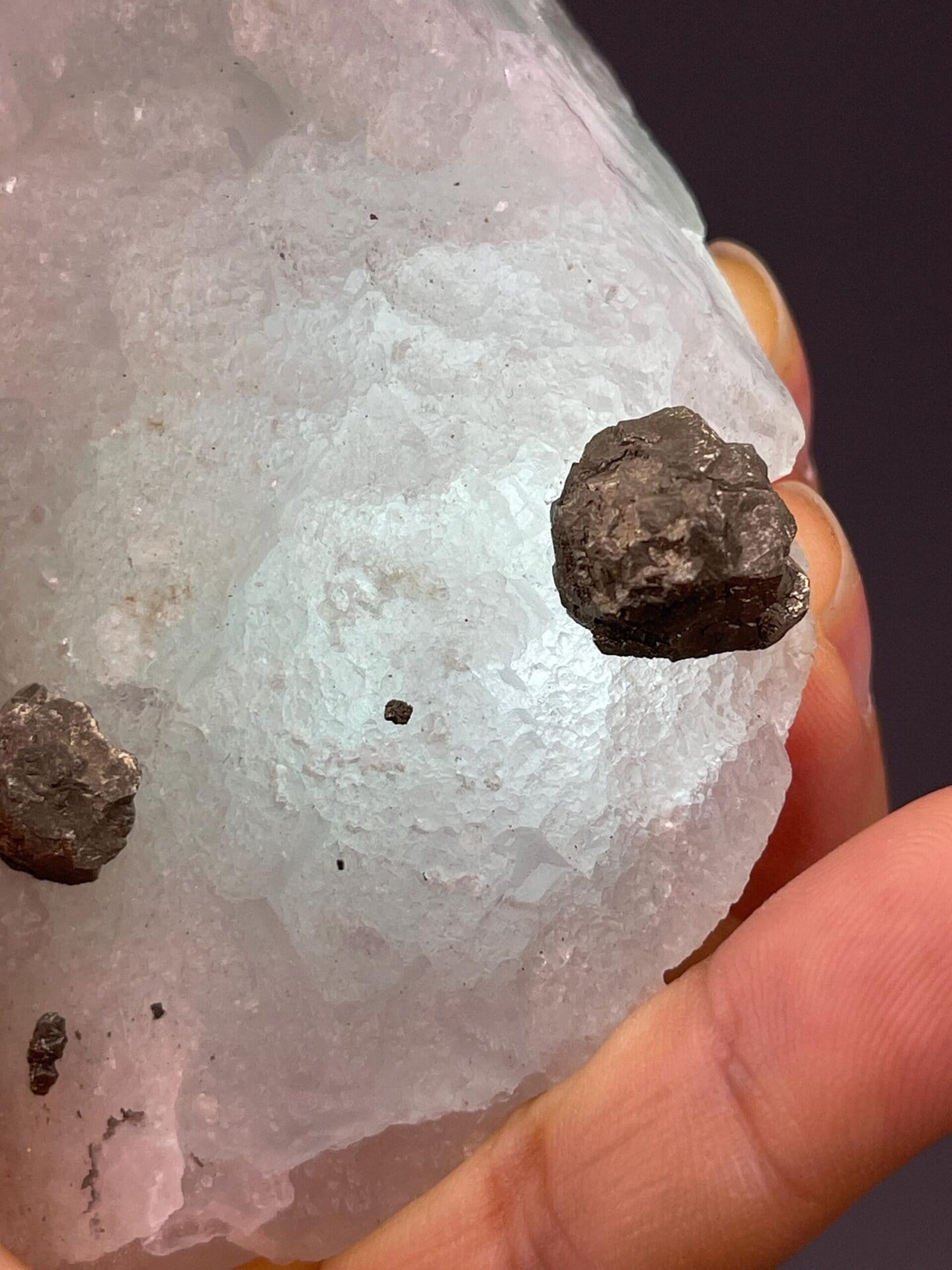 Metallic iron ore nodules in green fluorite matrix