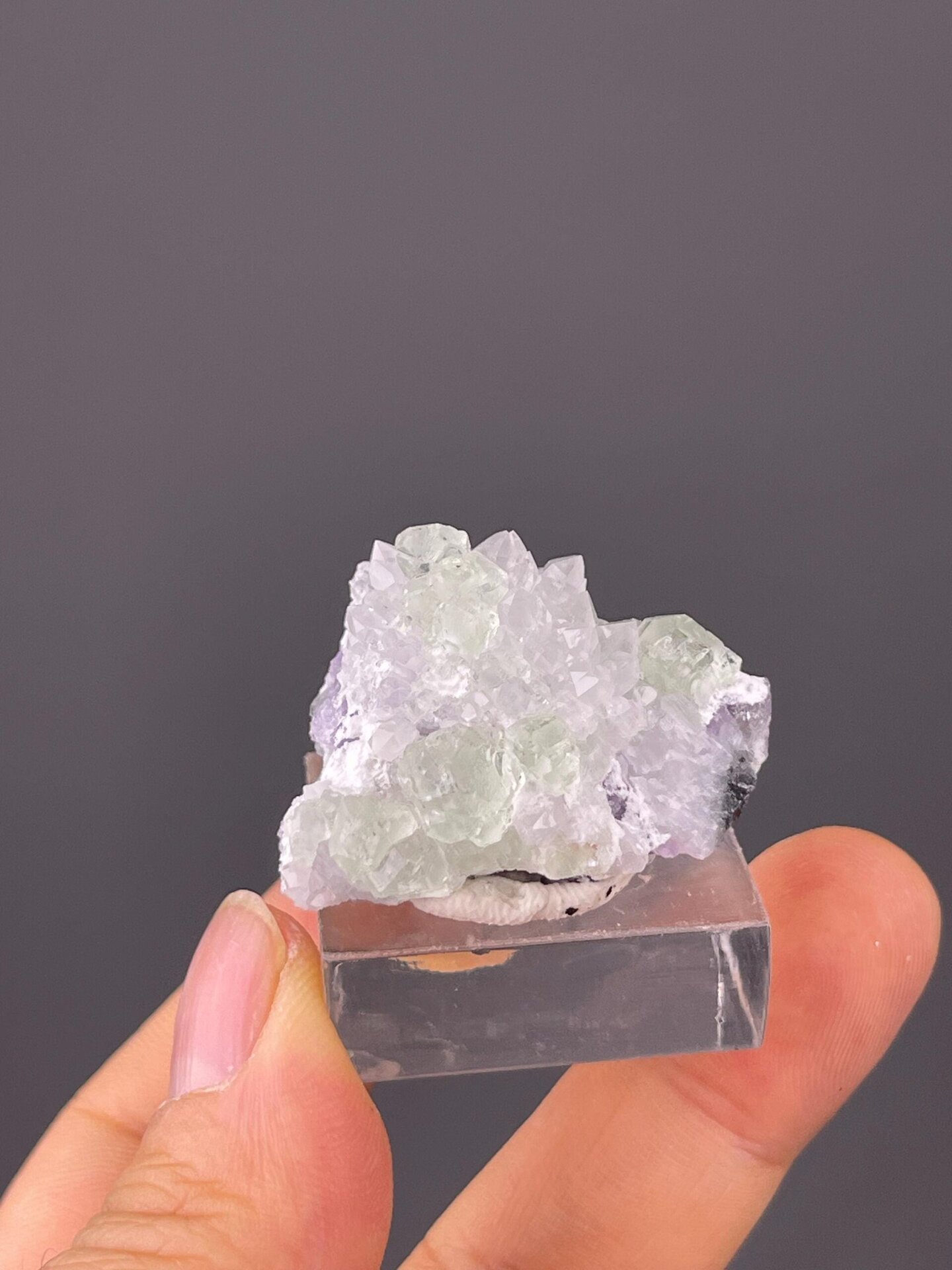 Close-up of green fluorite cubes with quartz accents