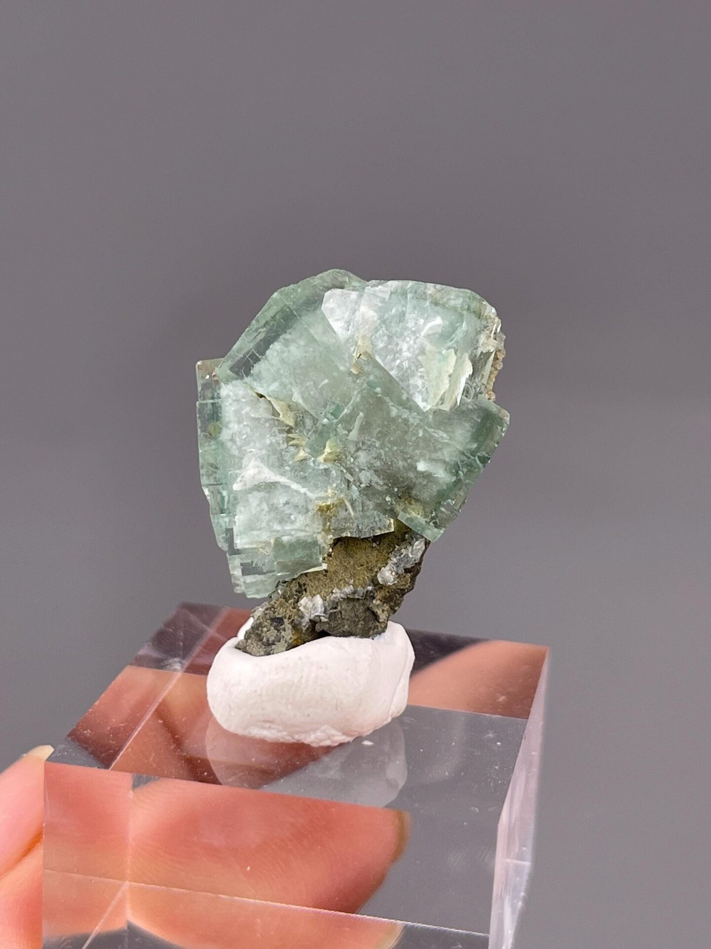 Side view of raw green fluorite crystal specimen