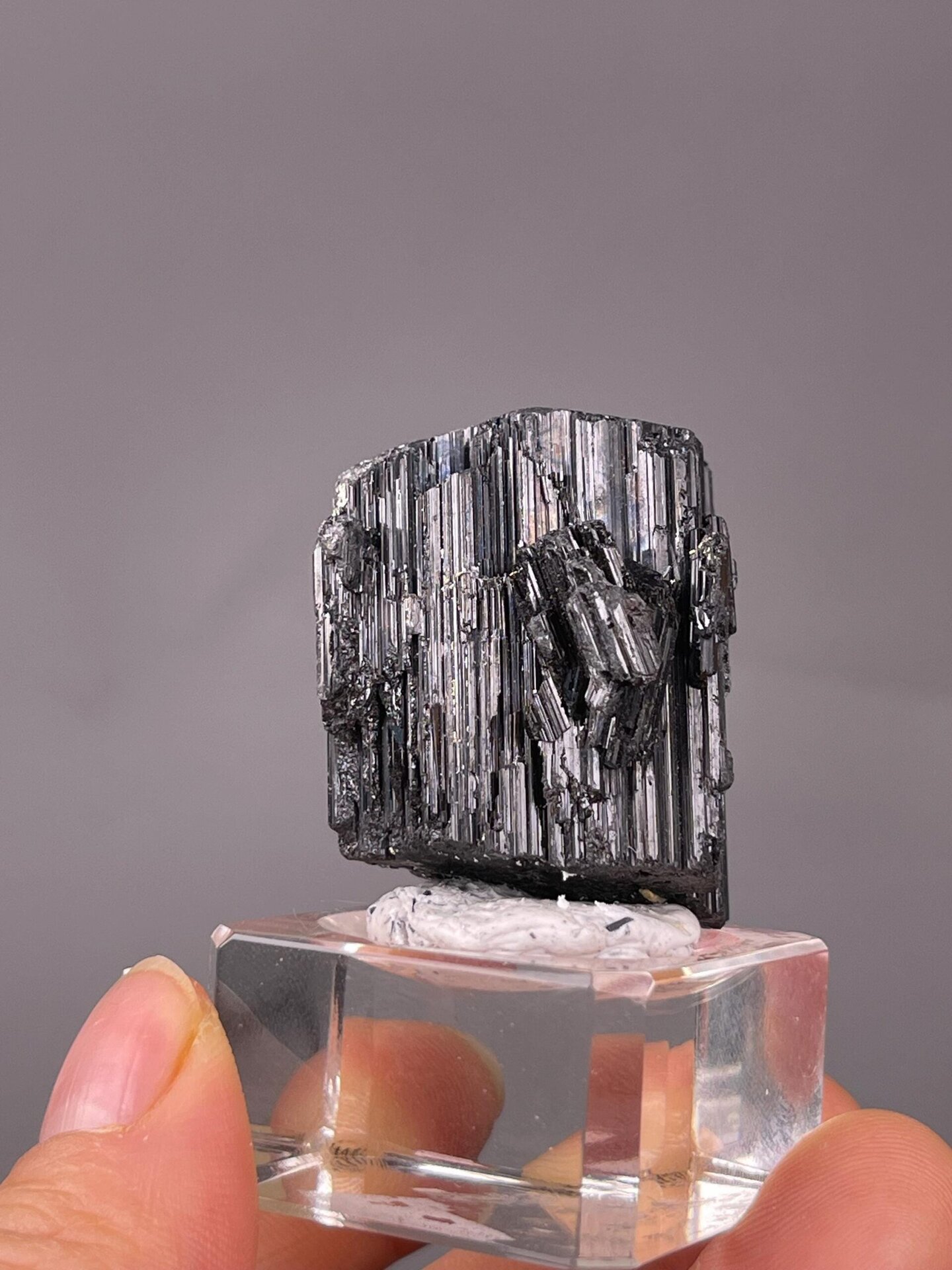 Multiple black tourmaline columns in cluster formation