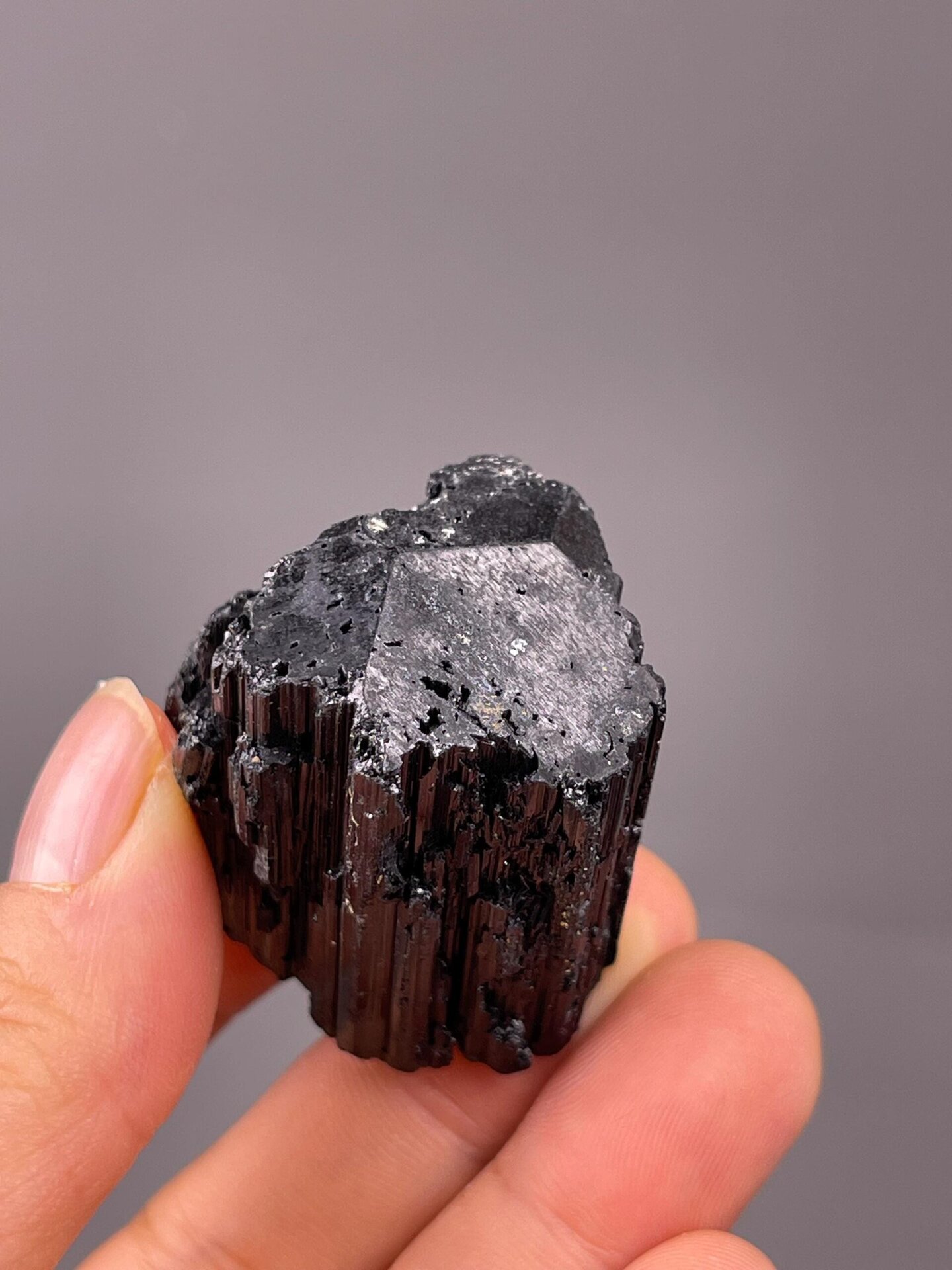 Vertical striations on black tourmaline crystal faces