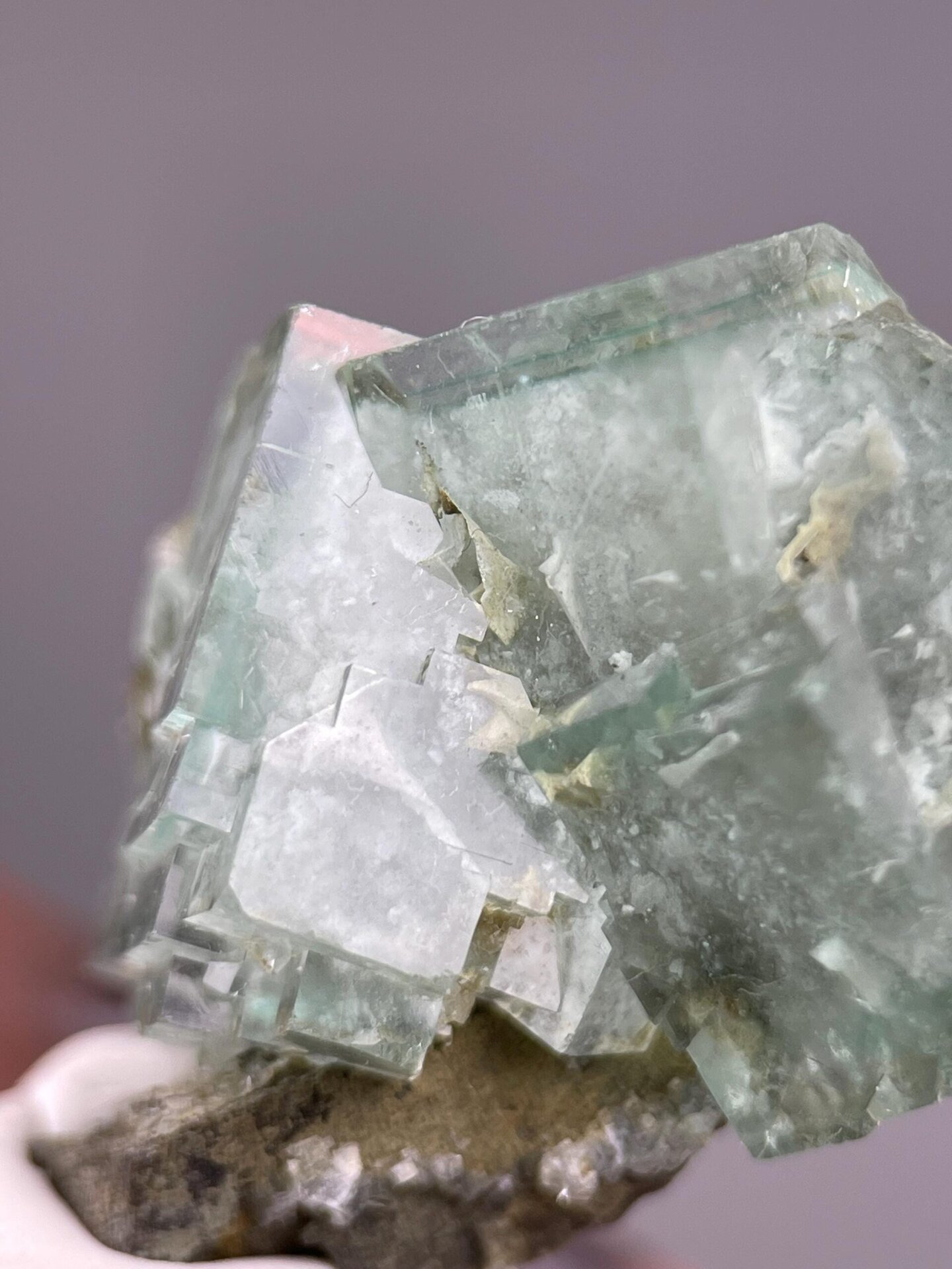Vitreous luster on green fluorite crystal faces