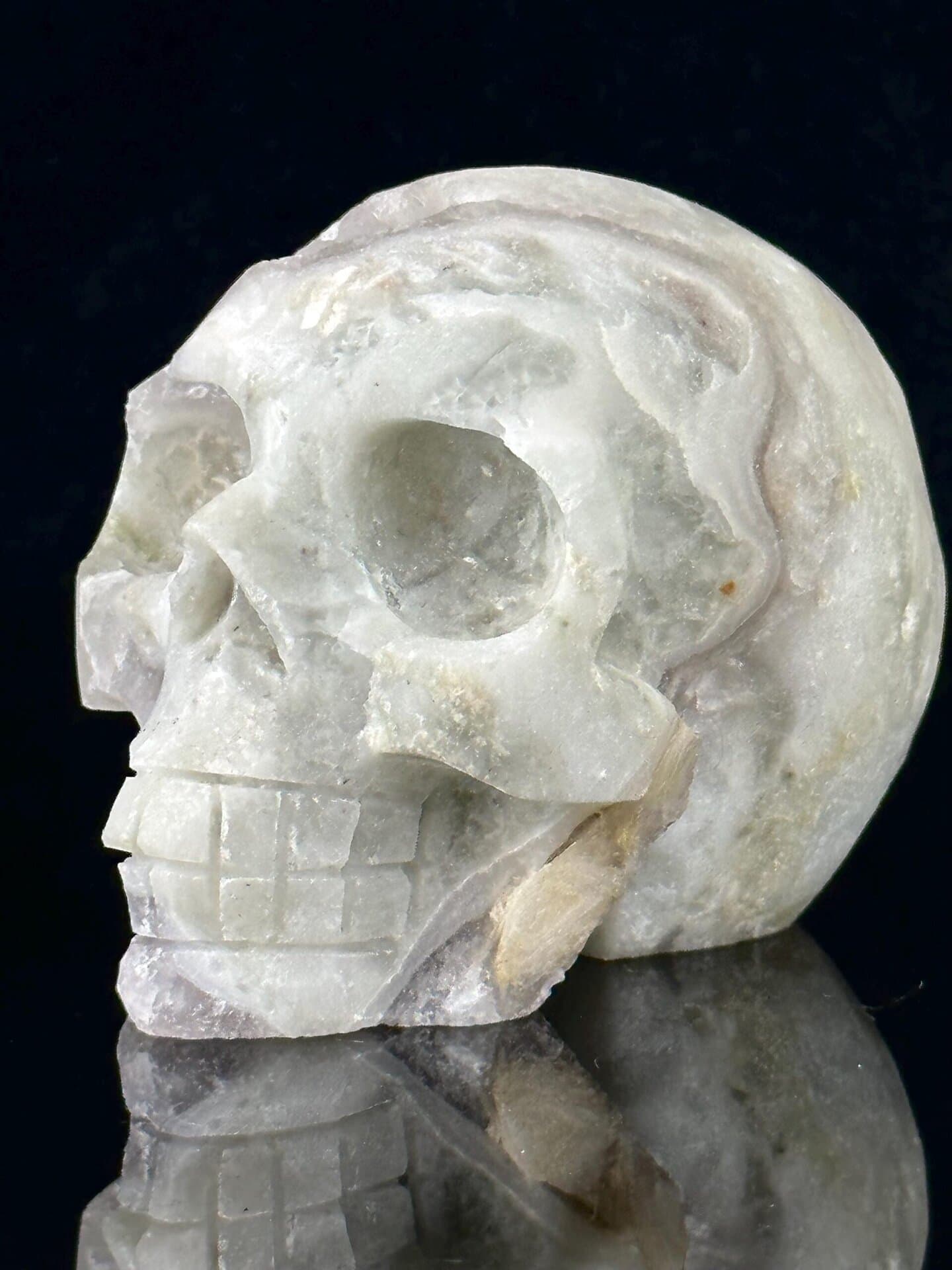 Front view of hand-carved fluorite skull with pyrite inclusions