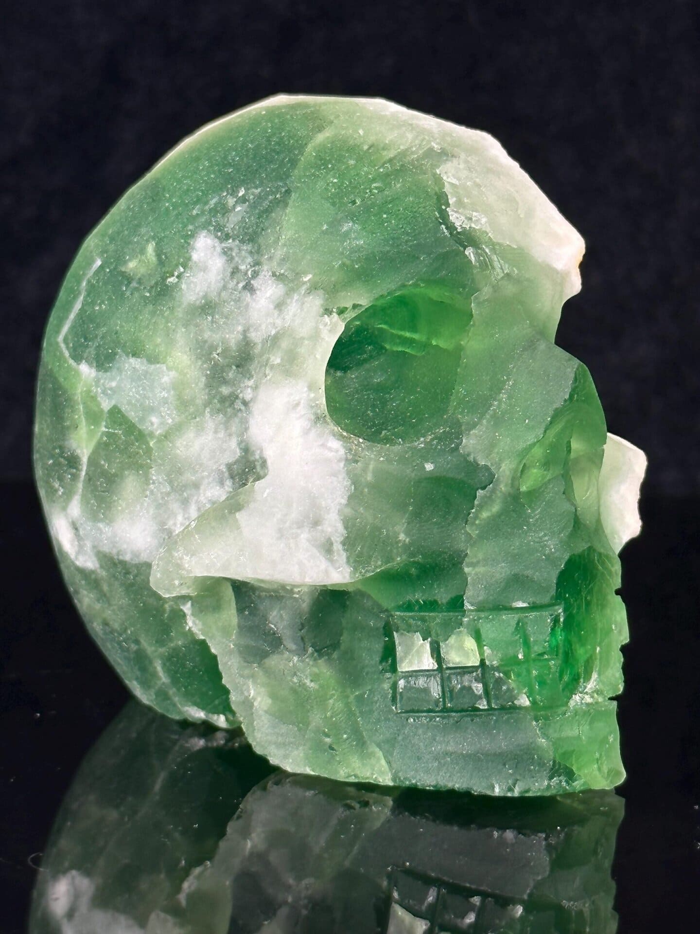 Front view of hand-carved deep green fluorite skull