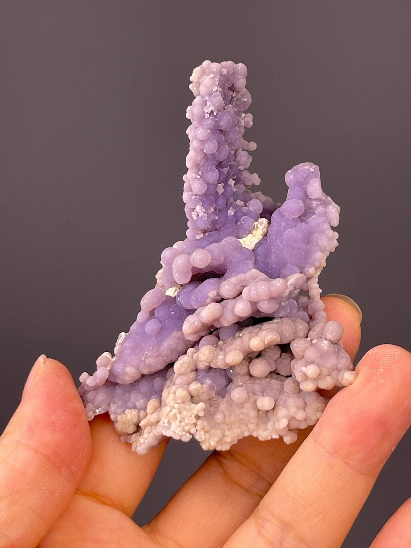 Side view of purple grape agate cluster