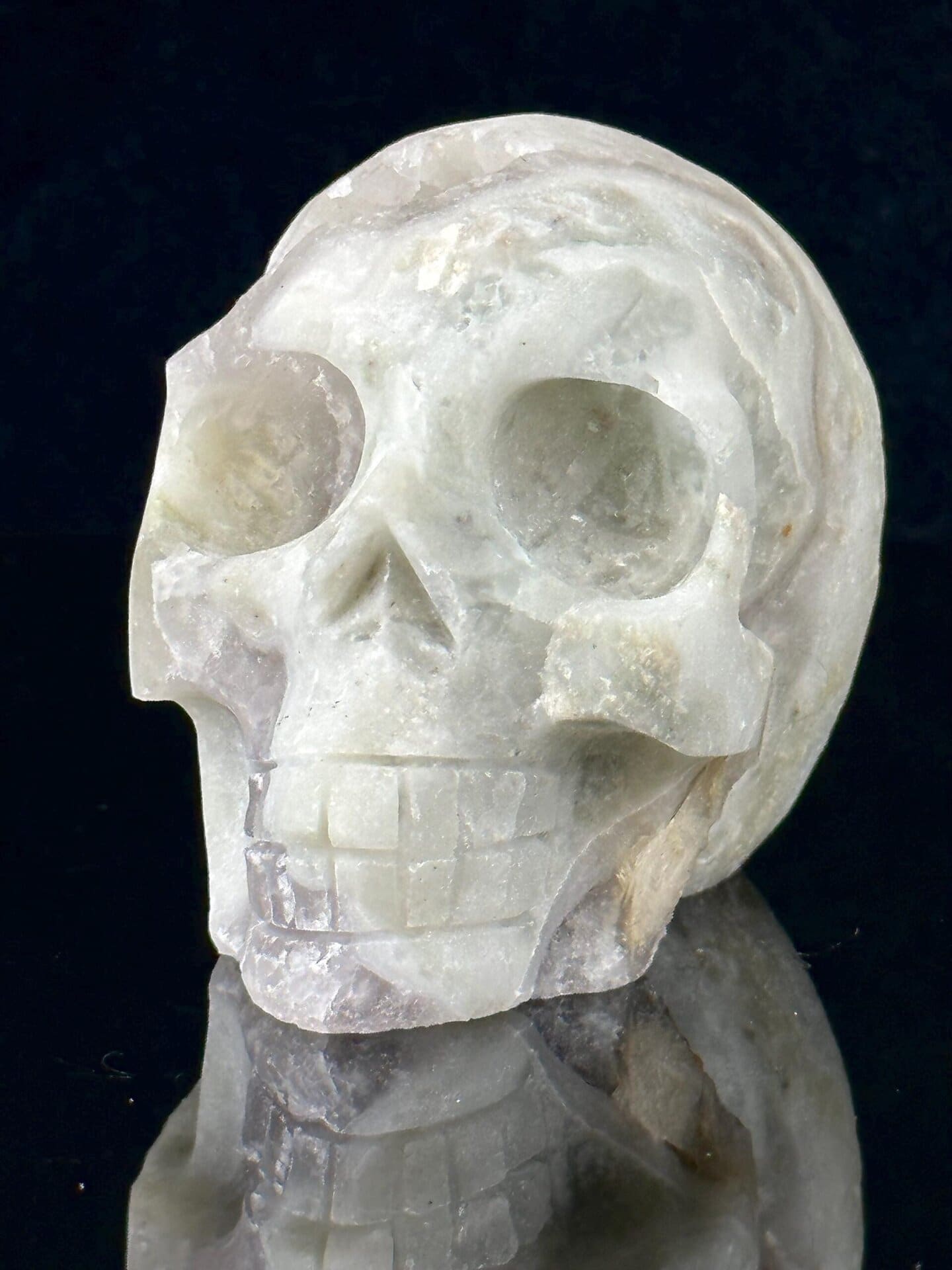 Polished fluorite skull surface showing pyrite sparkle