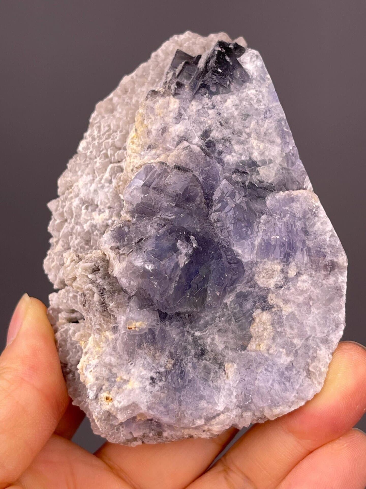 Side view of etched blue fluorite cluster