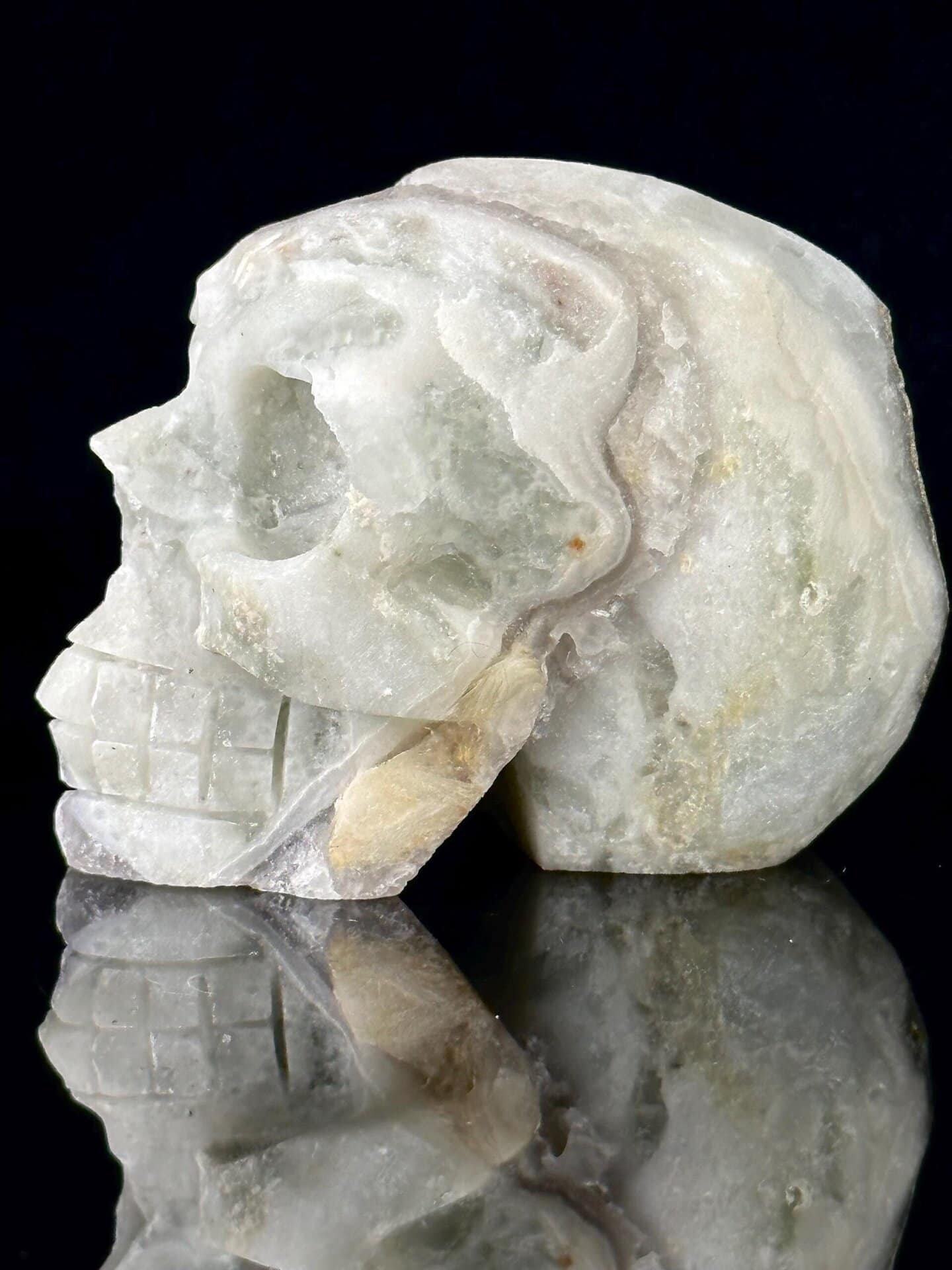 Three-quarter angle of fluorite skull with metallic inclusions